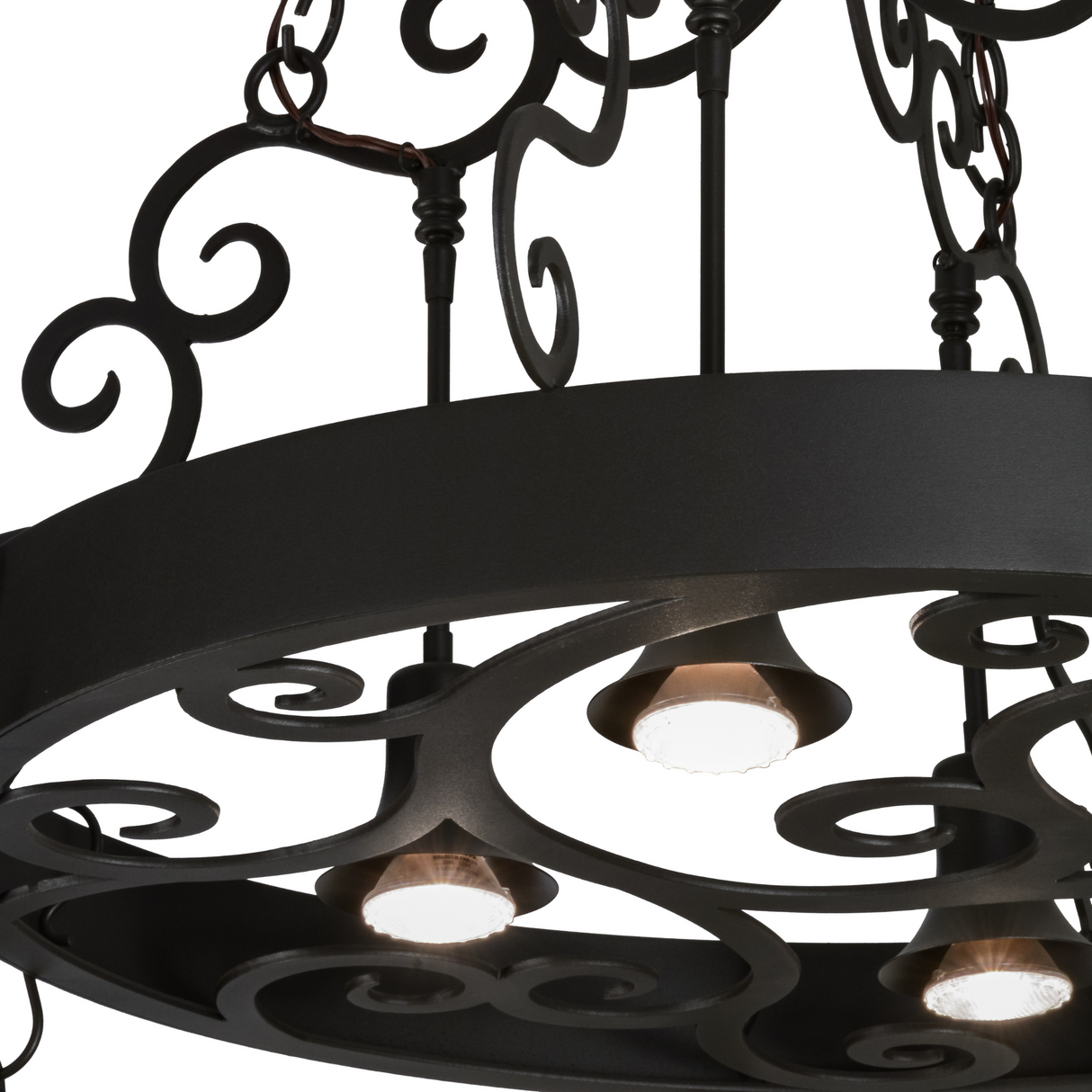 Close-up of Dior 4-light chandelier scrollwork and downlights.