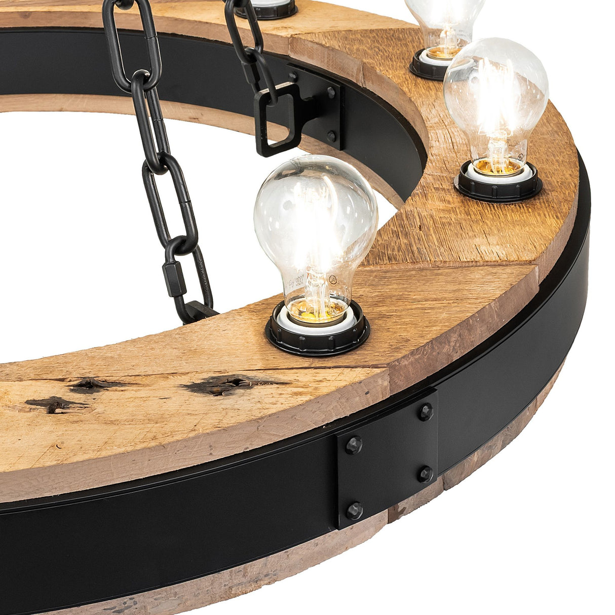 Close-up of Edison bulb mounted on rustic wood ring.