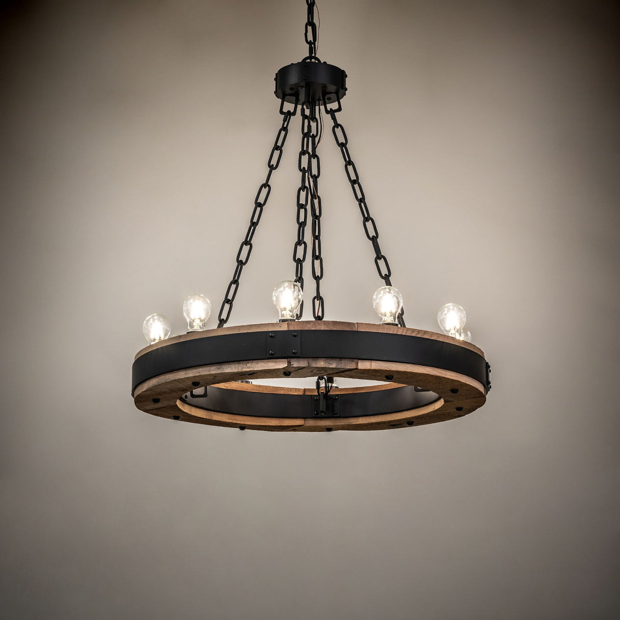 Lit Dowling 10-light chandelier creating warm ambient lighting.