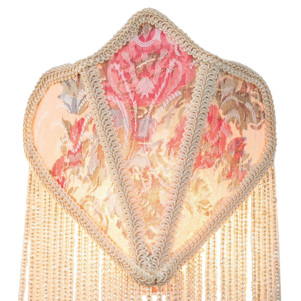 Close view of pink floral damask pattern on night light.