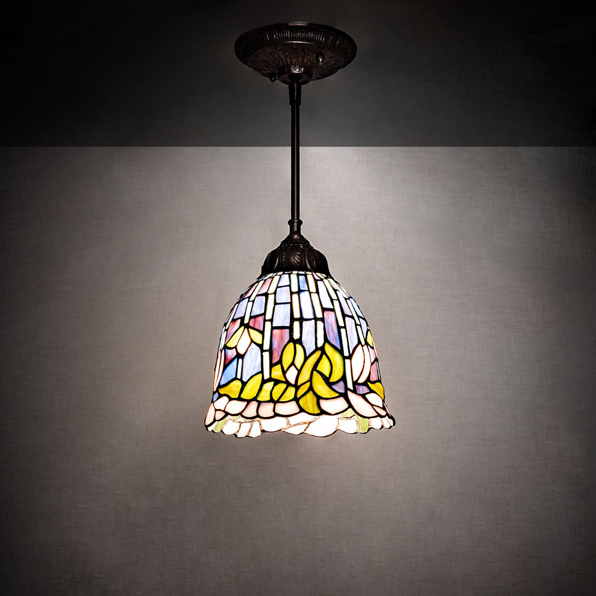 Illuminated Tiffany Flowering Lotus Mini Pendant showcasing colorful stained glass.