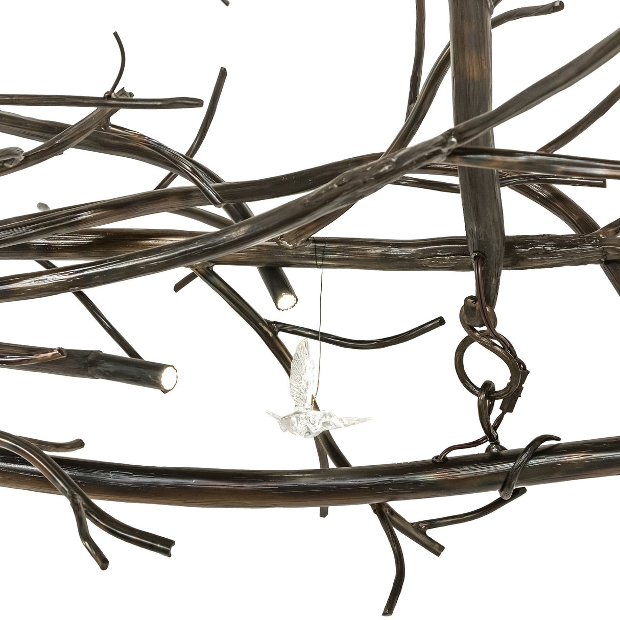 Clear hummingbird accent detail on Gardner chandelier branch.