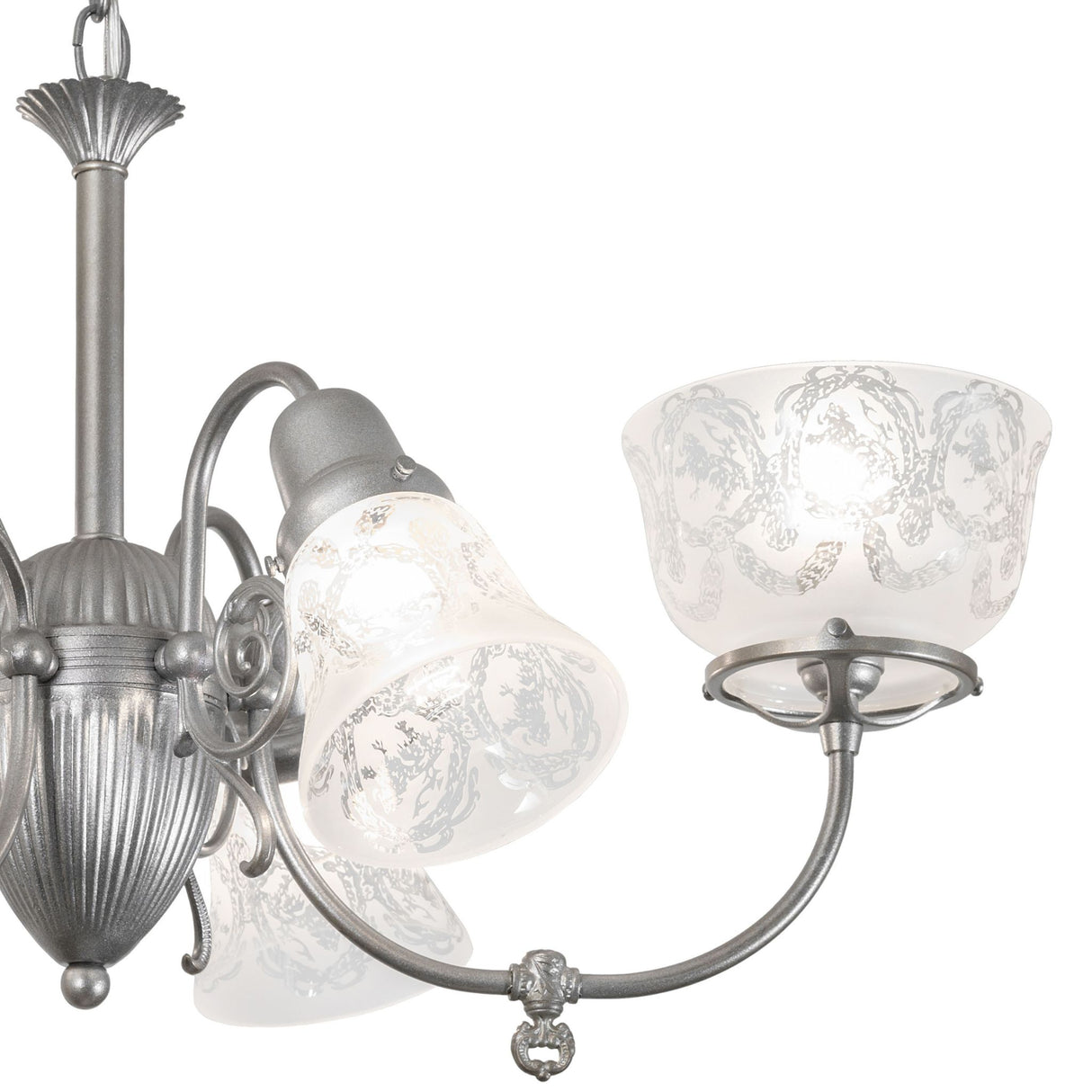 Close-up of glass shade and curved metal arm on gas and electric 6 light chandelier.