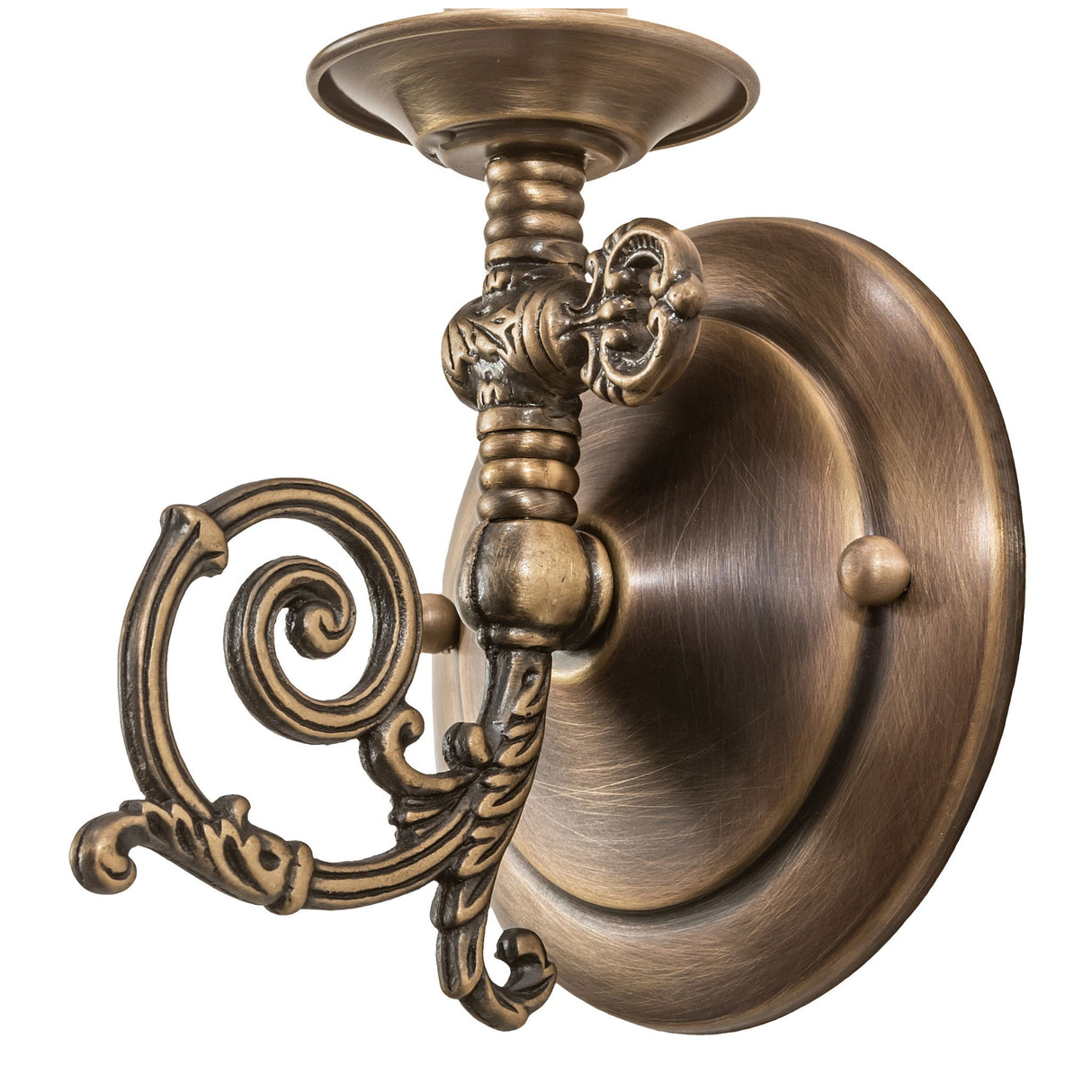 Close-up of ornate antique brass sconce arm and scroll design.