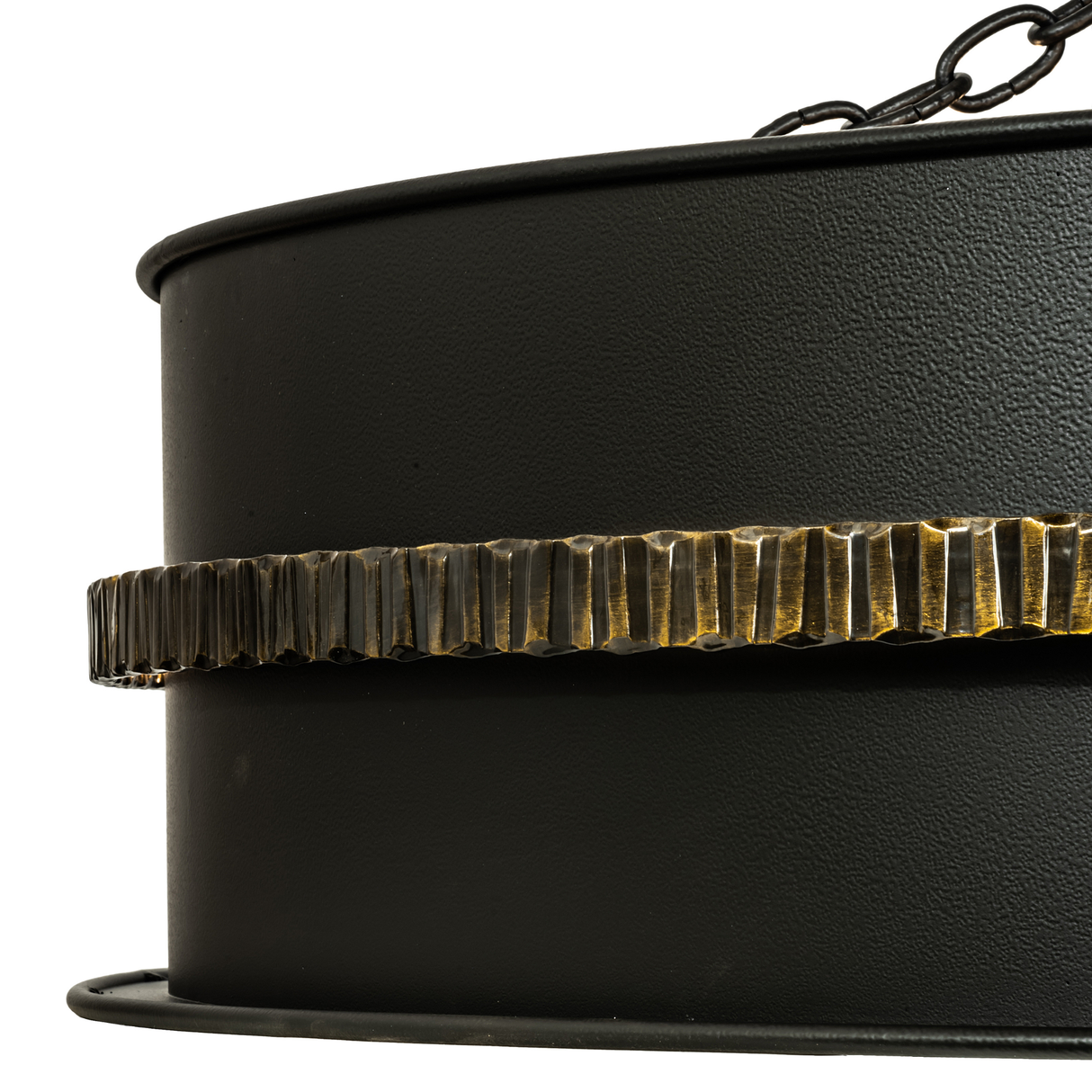 Close-up of hammered iron band with antique brass edge highlights.