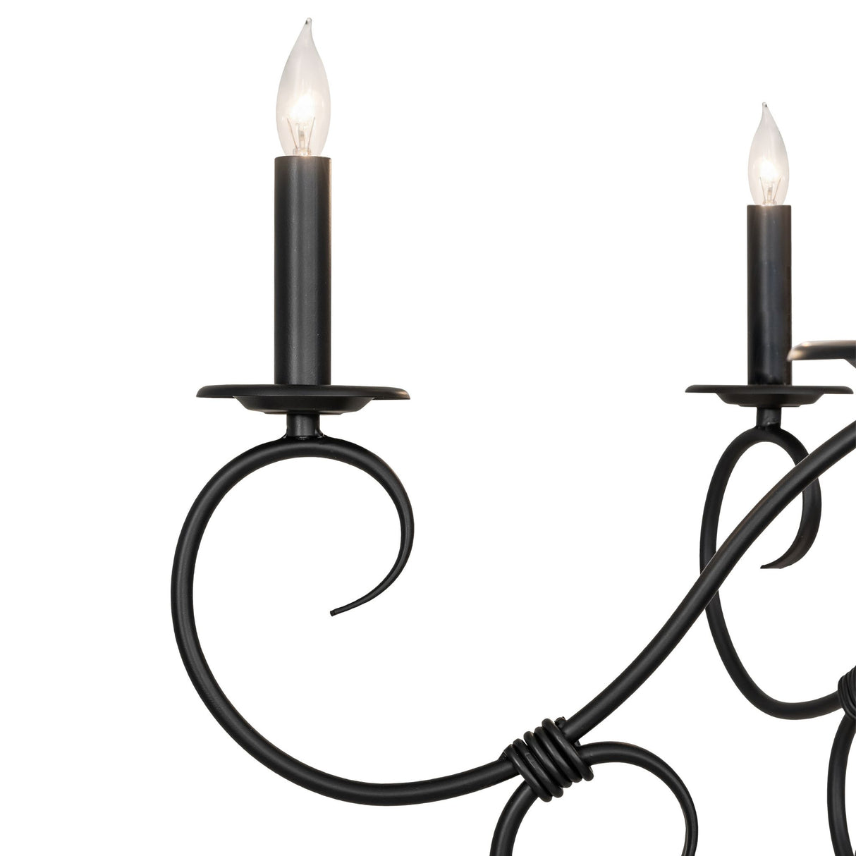 Close-up of scrolled arm and faux candle bobeche.