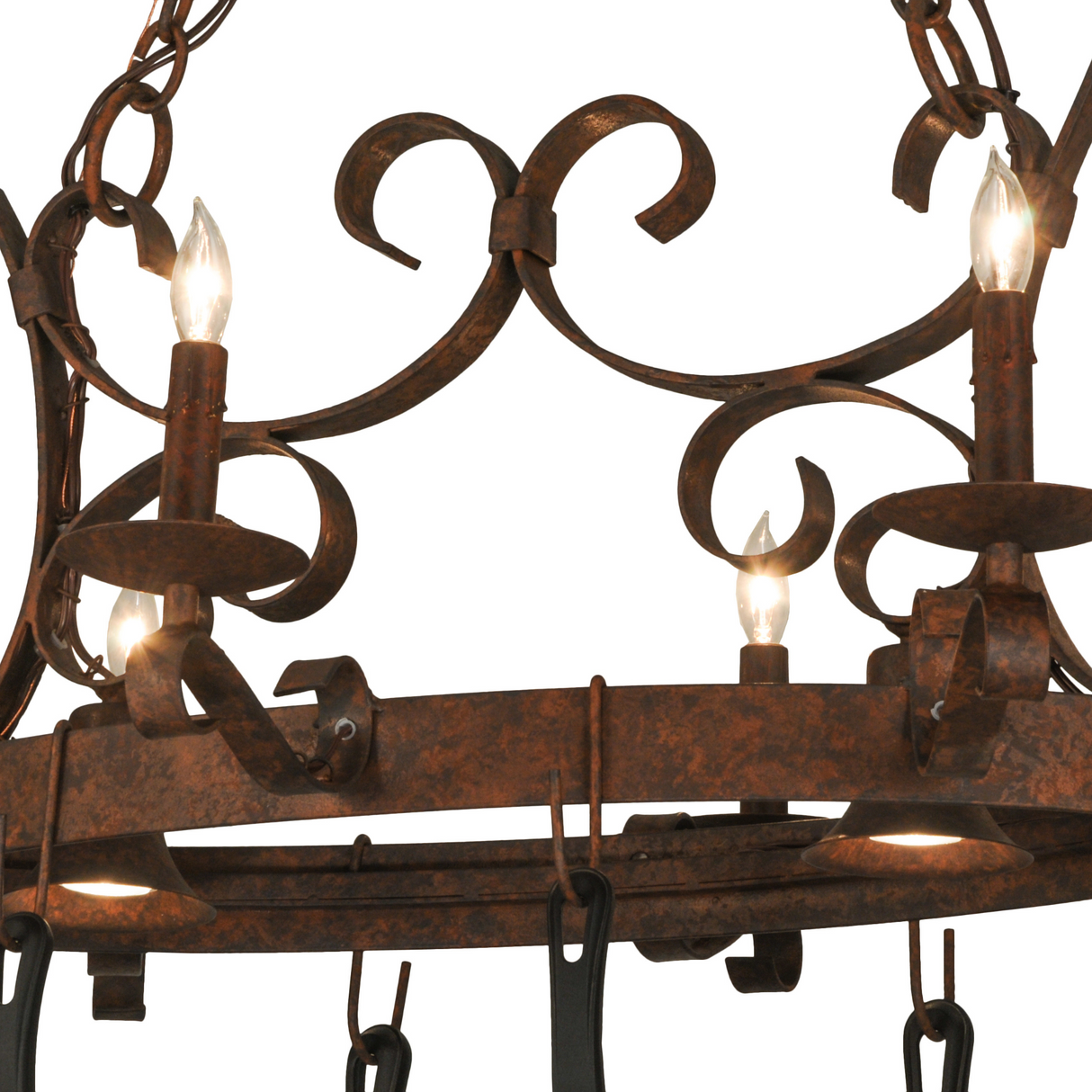 Close-up of iron scroll detail on pot rack chandelier.