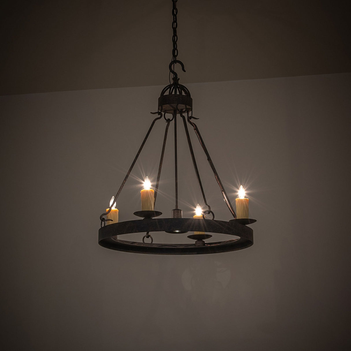 Lakeshore 4 light chandelier with ambient room lighting, rustic coffee bean metal frame.