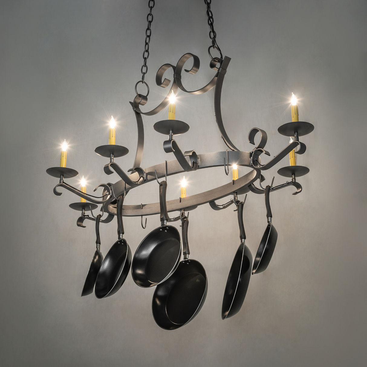 Laramie chandelier glowing in rustic kitchen setting.