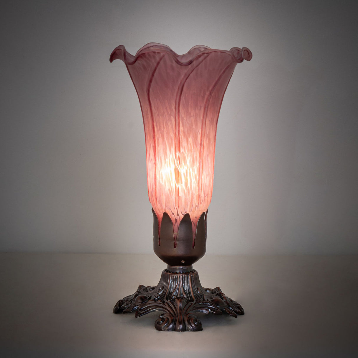 Illuminated Lavender Pond Lily mini lamp casting a warm glow.