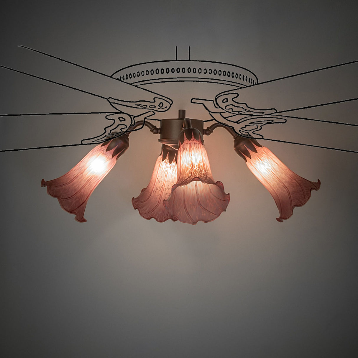 Ambient view of the Tiffany Pond Lily fan light softly glowing.