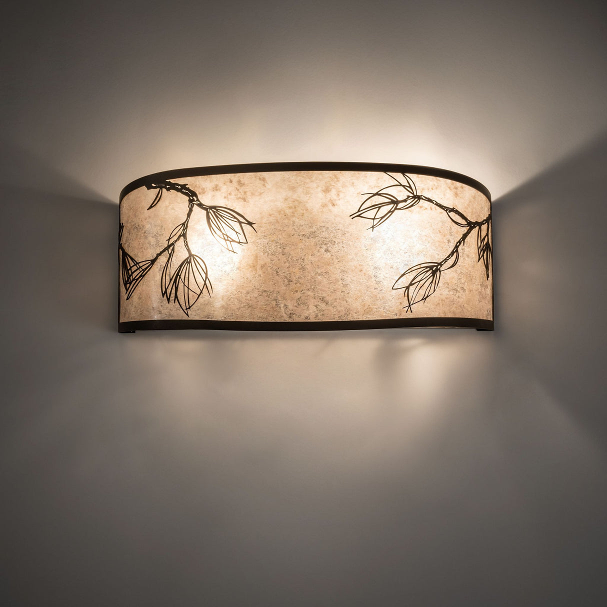 Illuminated view of the Lone Pine Vanity Light highlighting its warm silver mica diffuser.
