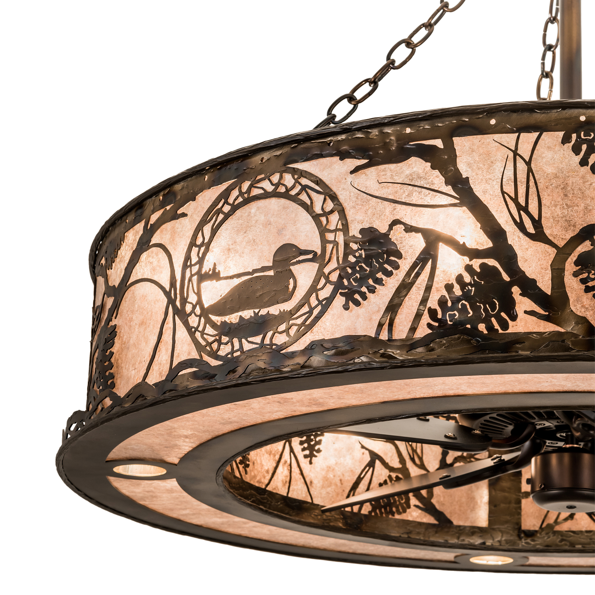 Close-up of loon silhouette and pinecone design on illuminated mica diffuser.