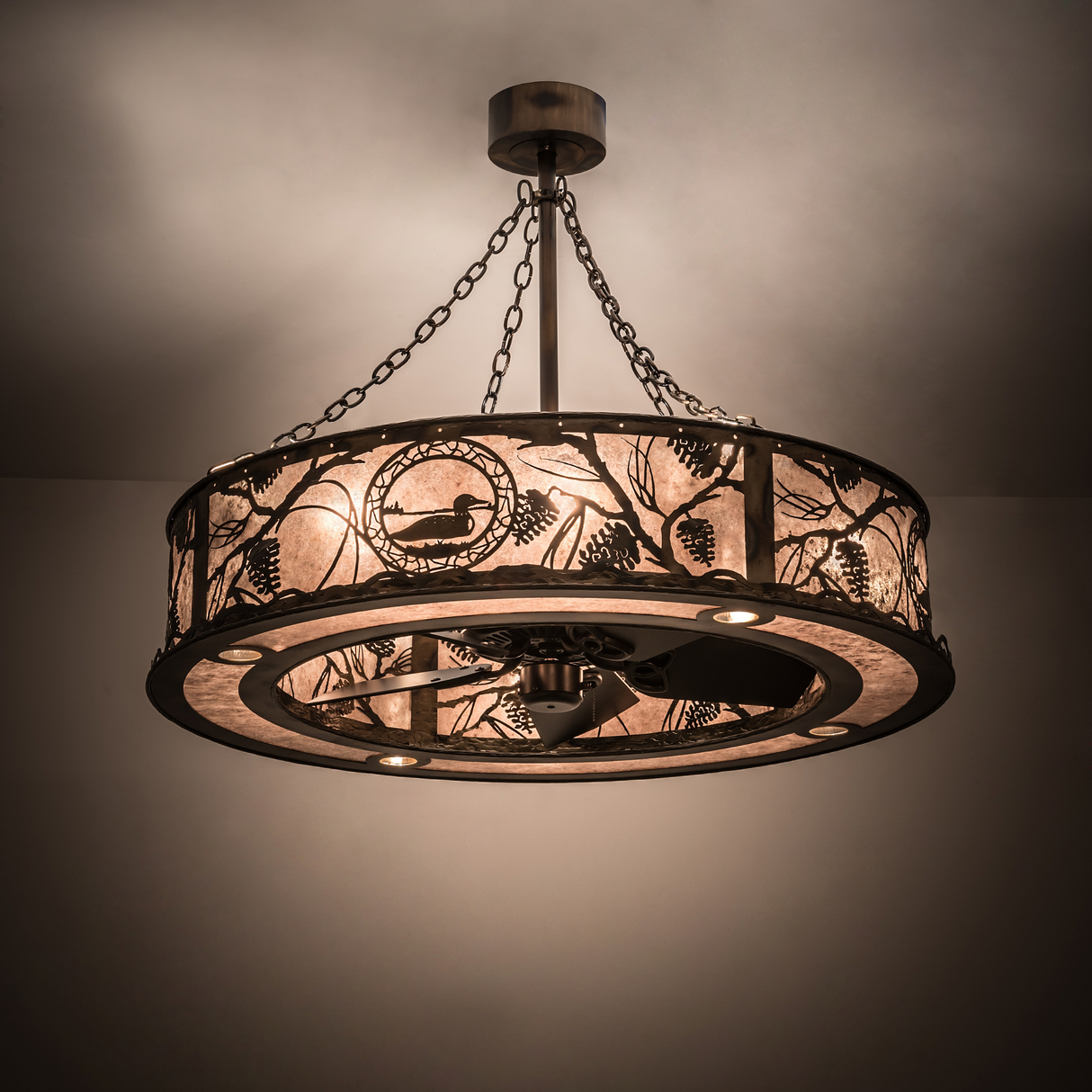 Illuminated Loon Chandel-Air glowing warmly in a softly lit interior.