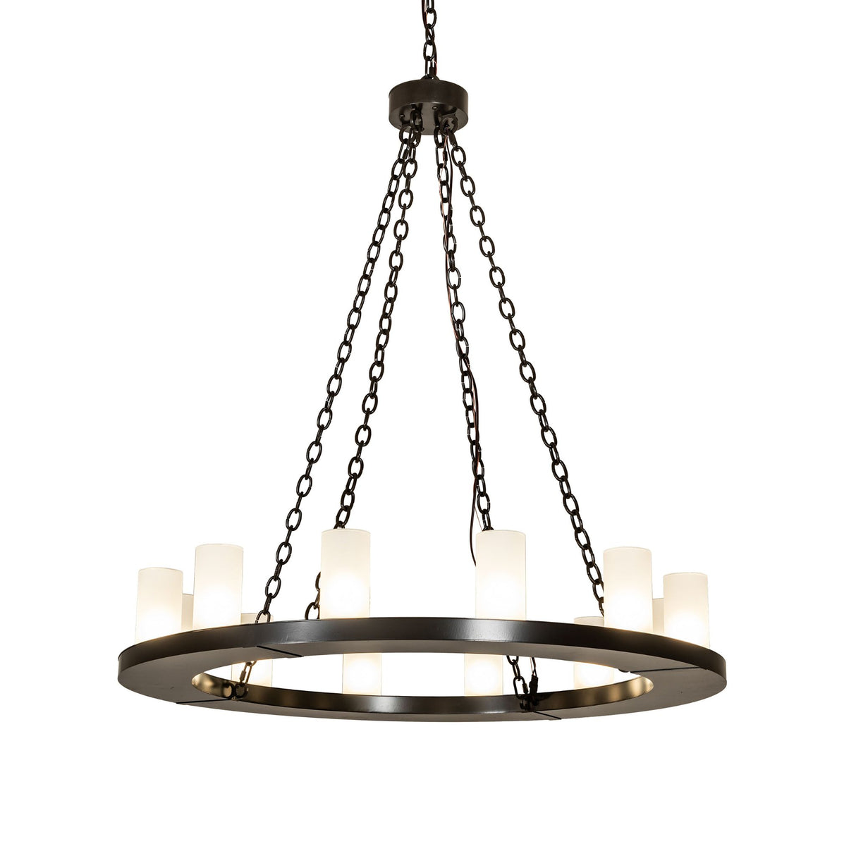 Lit view of 12 light chandelier illuminated with frosted glass cylinder shades.