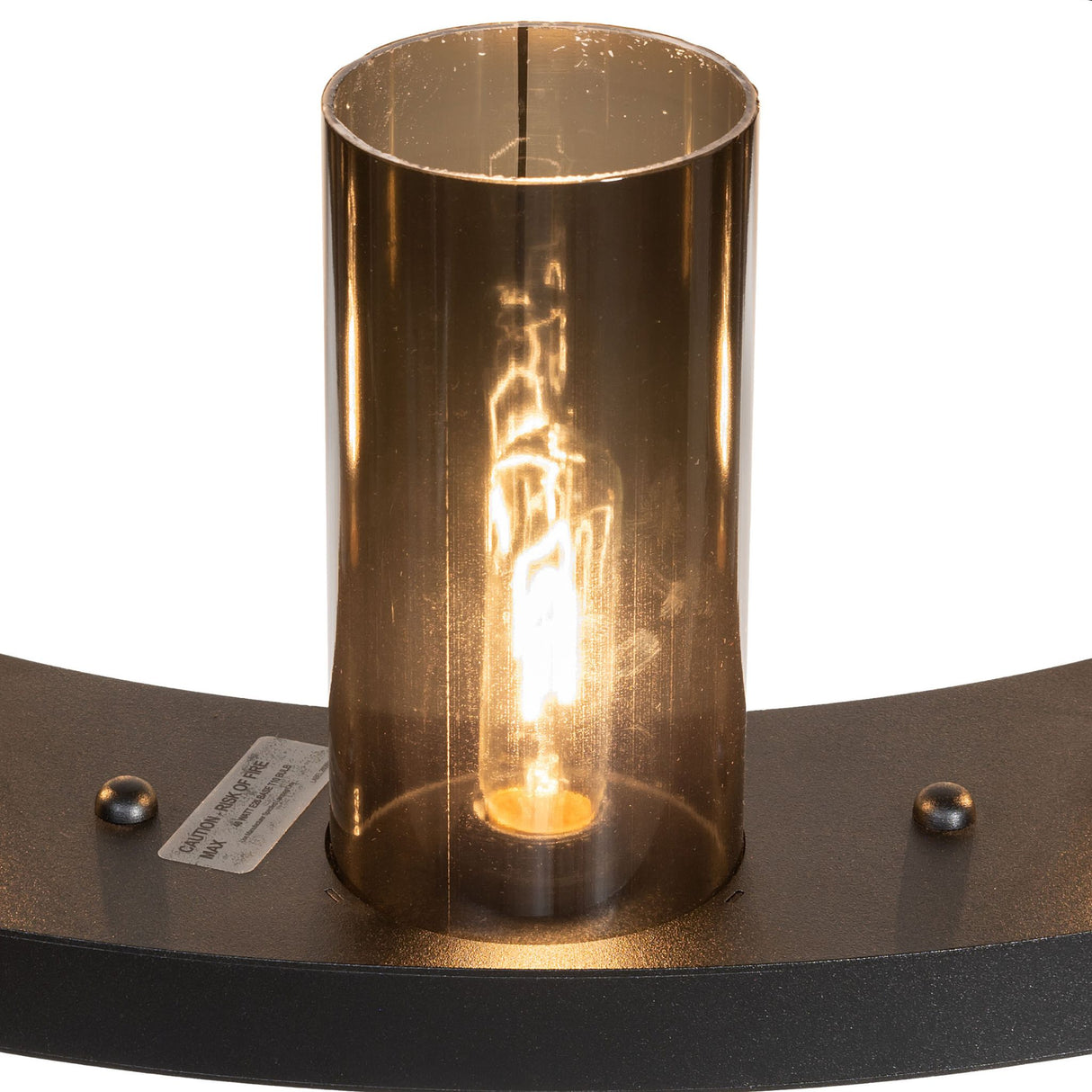 Close up of grey smoke glass cylinder shade on chandelier.