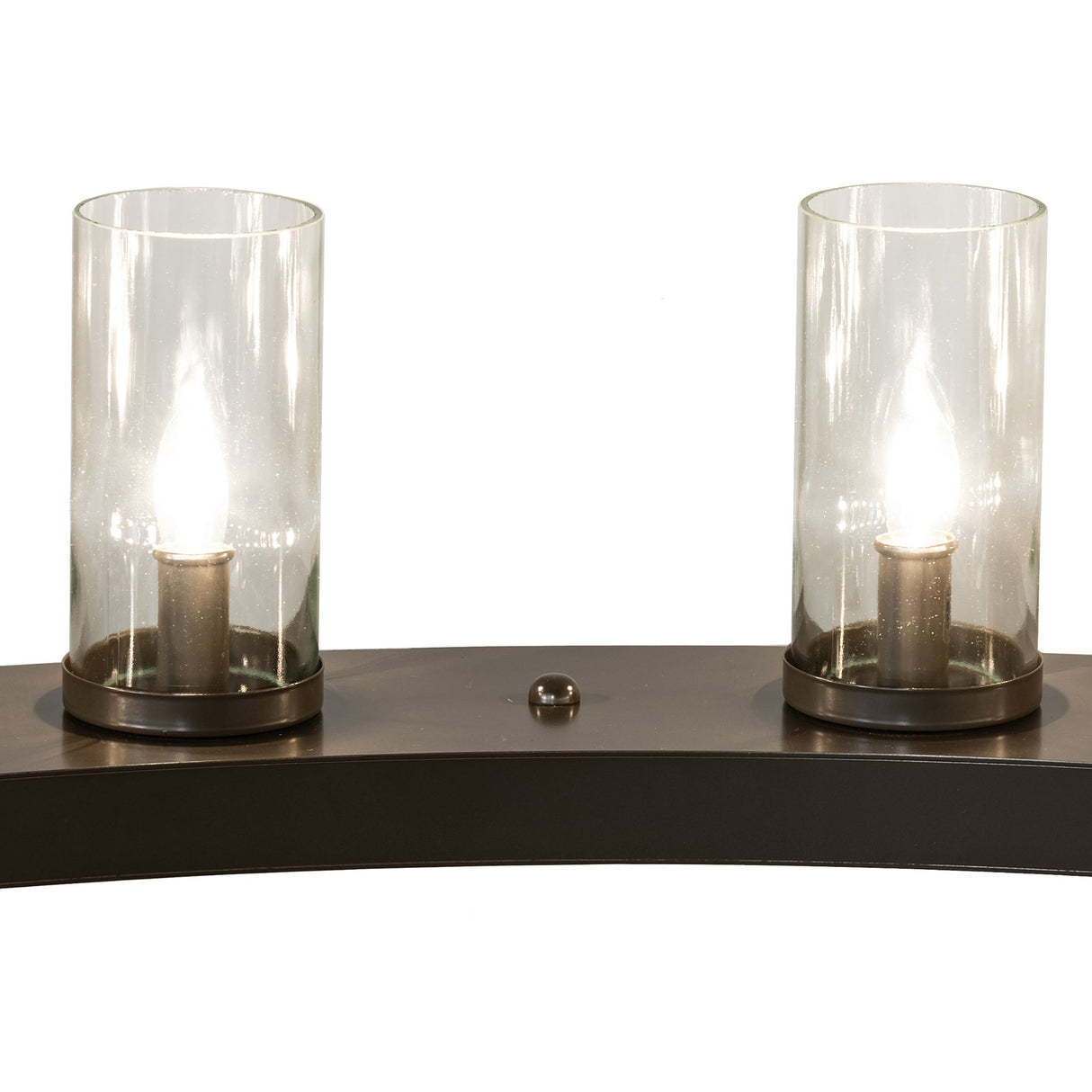 Detail view of two illuminated clear glass cylinder shades mounted on the chandelier ring.