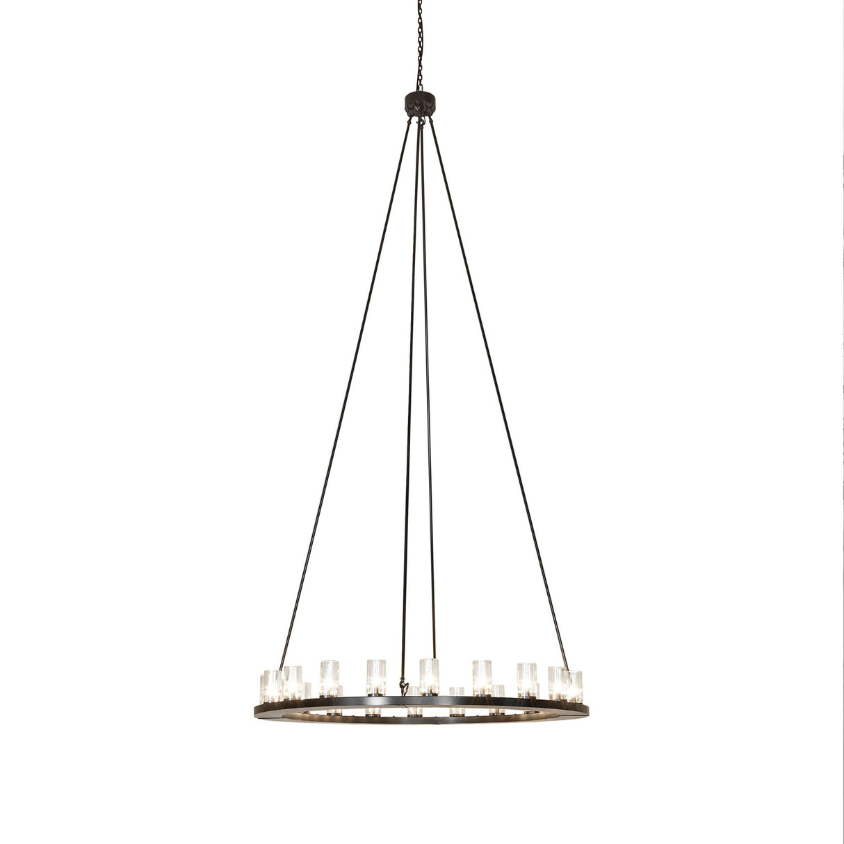 Lit view of the chandelier with clear glass cylinder shades and bronze finish.