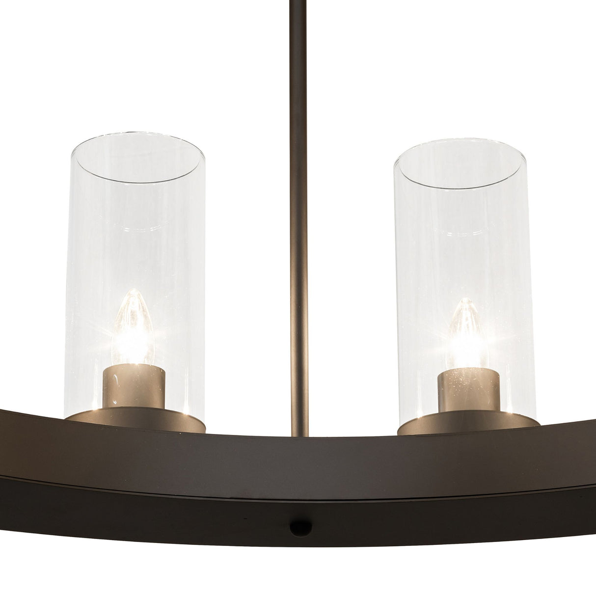Clear glass cylinder shade detail with visible candle-style bulb.