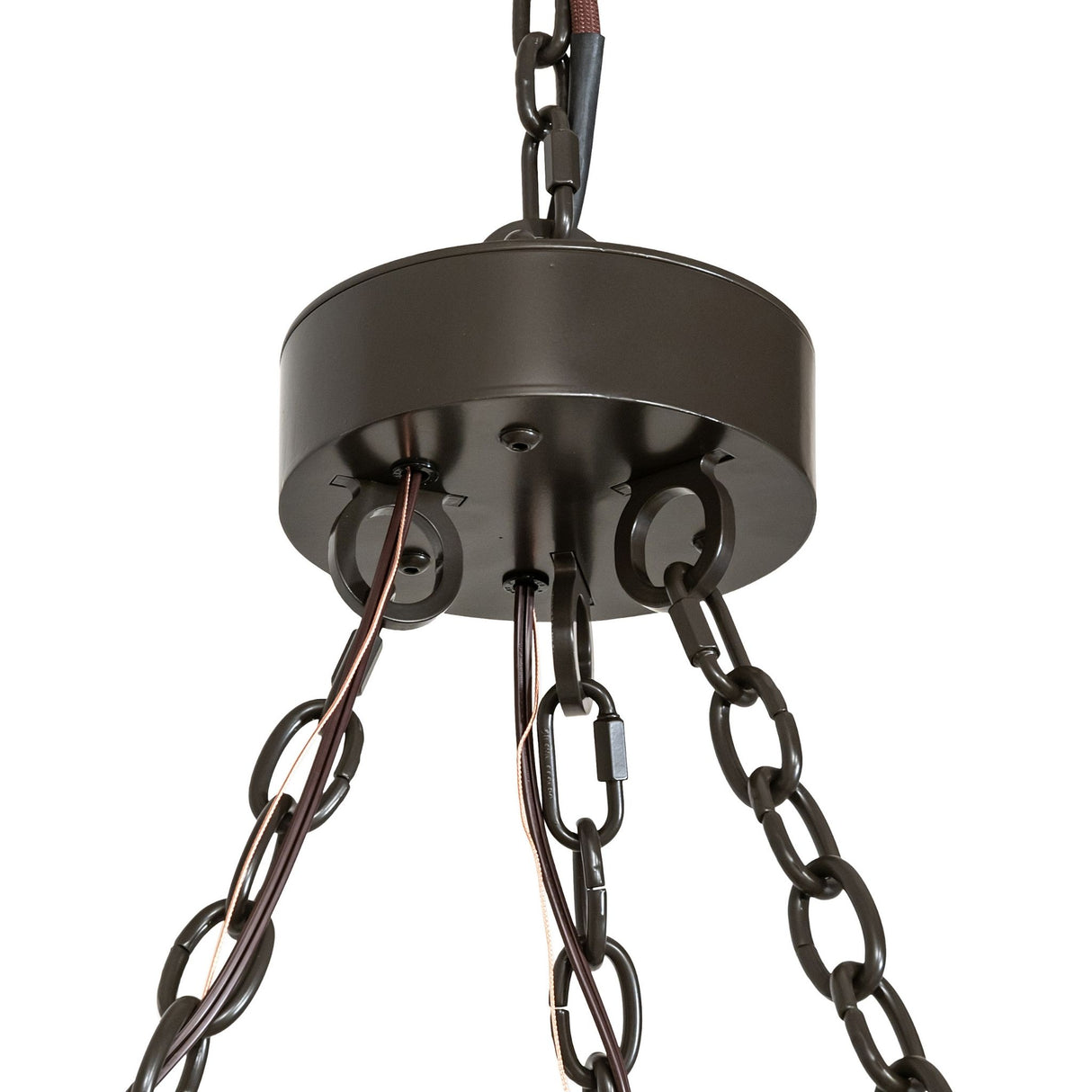 Closeup of suspension showing bronze canopy, chain hardware, and mounting detail.