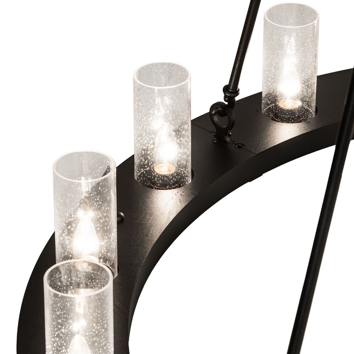 Close-up of clear seeded glass cylinder shade with visible bubbles.