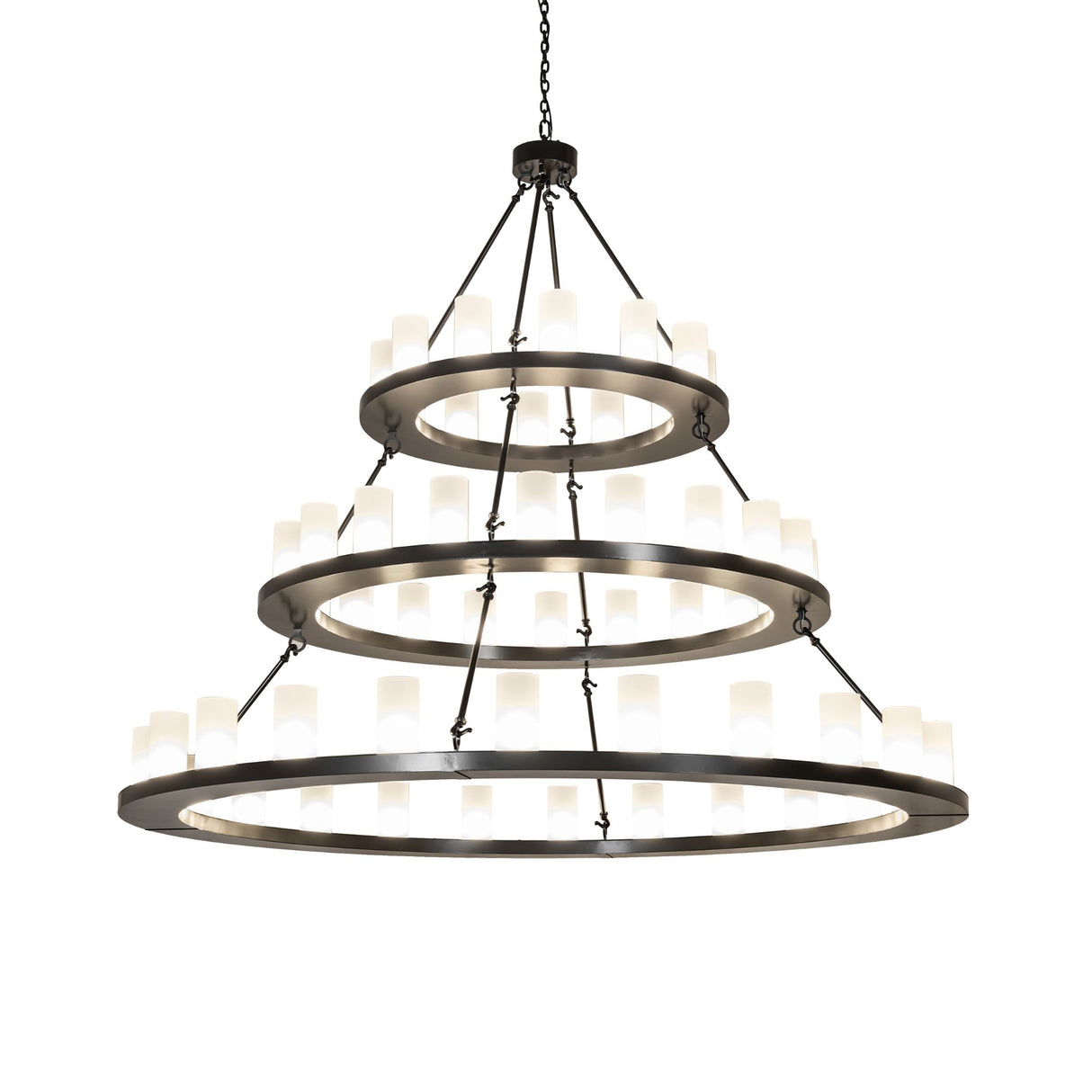 Illuminated chandelier with glowing frosted glass cylinders on three rings.
