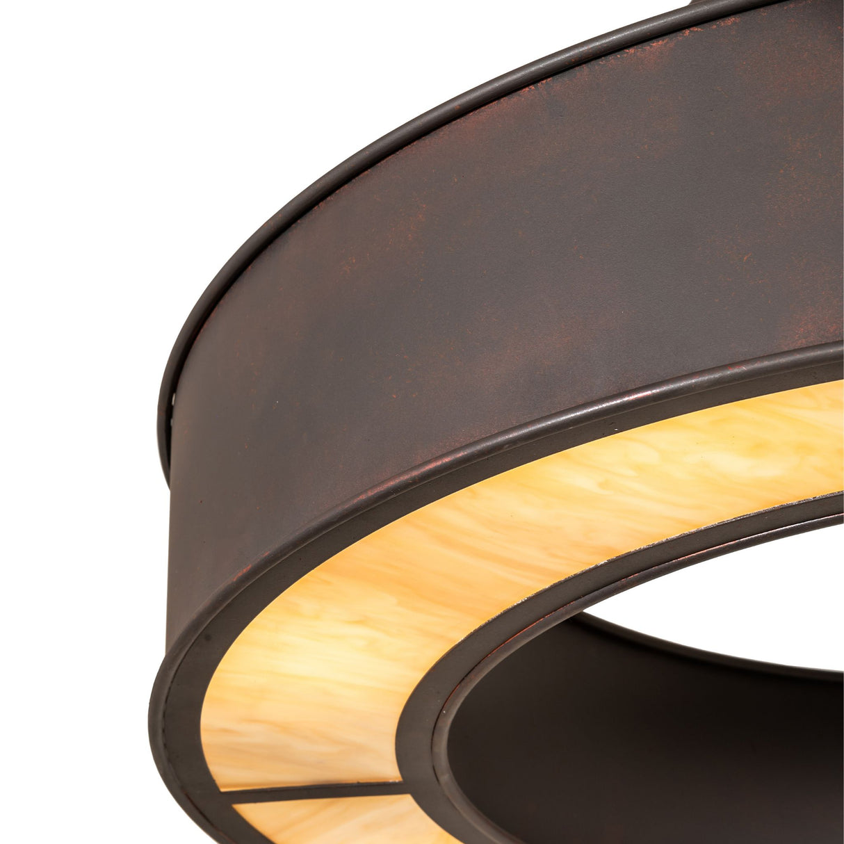 Close-up detail of travertine Idalight diffuser with warm marbled texture and metal trim.