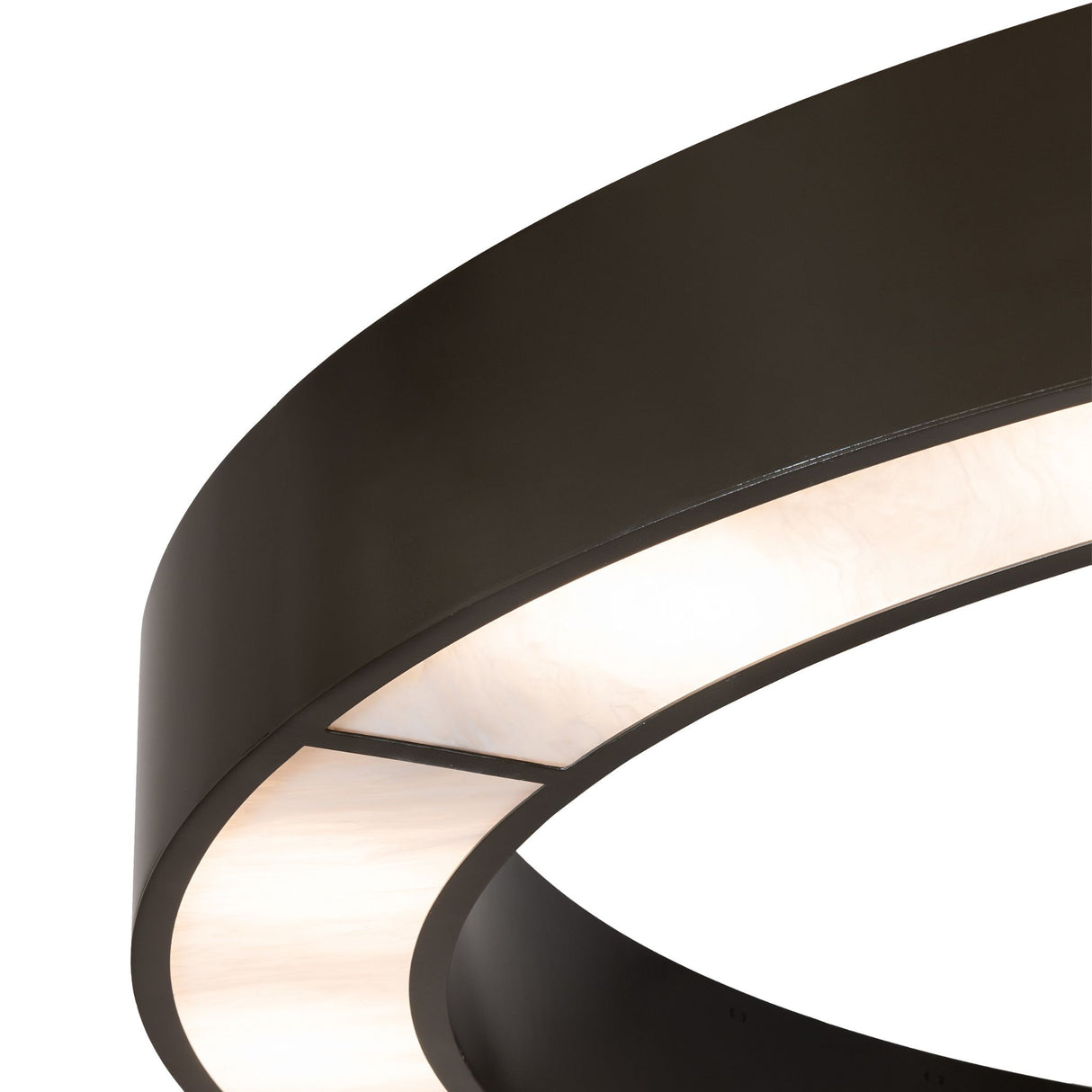 Close-up detail of illuminated Whitestone Idalight diffuser and curved bronze frame.