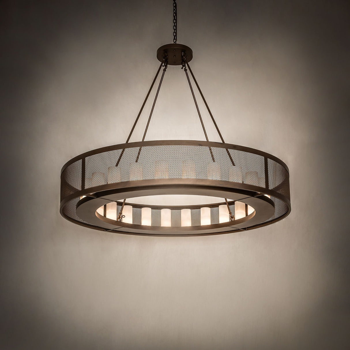 Ambient room view of the lit Loxley Golpe 24 light chandelier against a dark background.