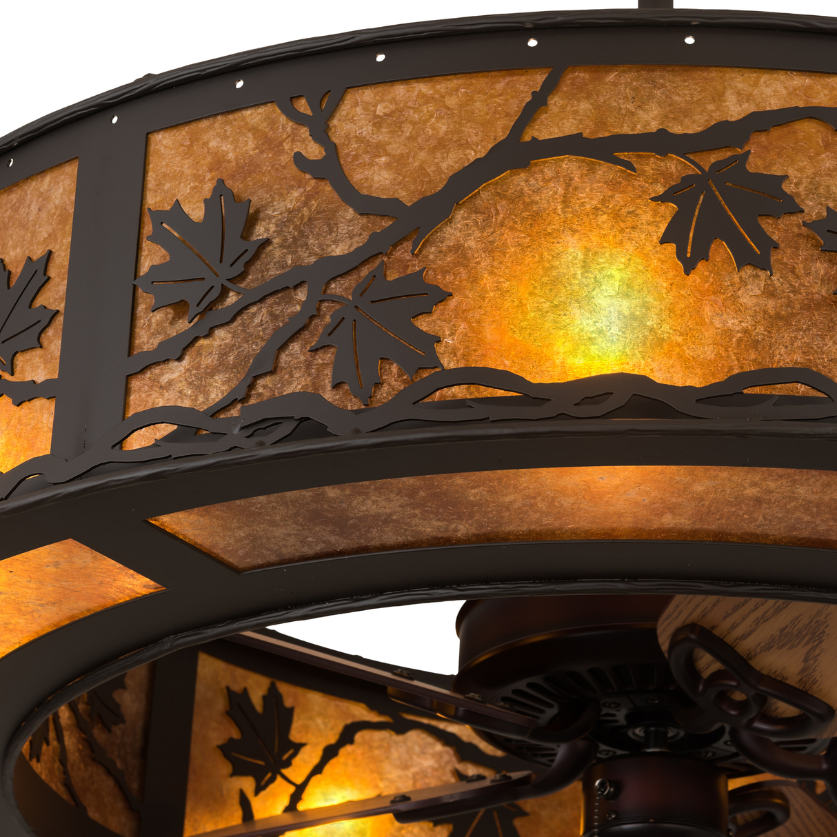 Close-up of maple leaf cutout detail against amber mica background.