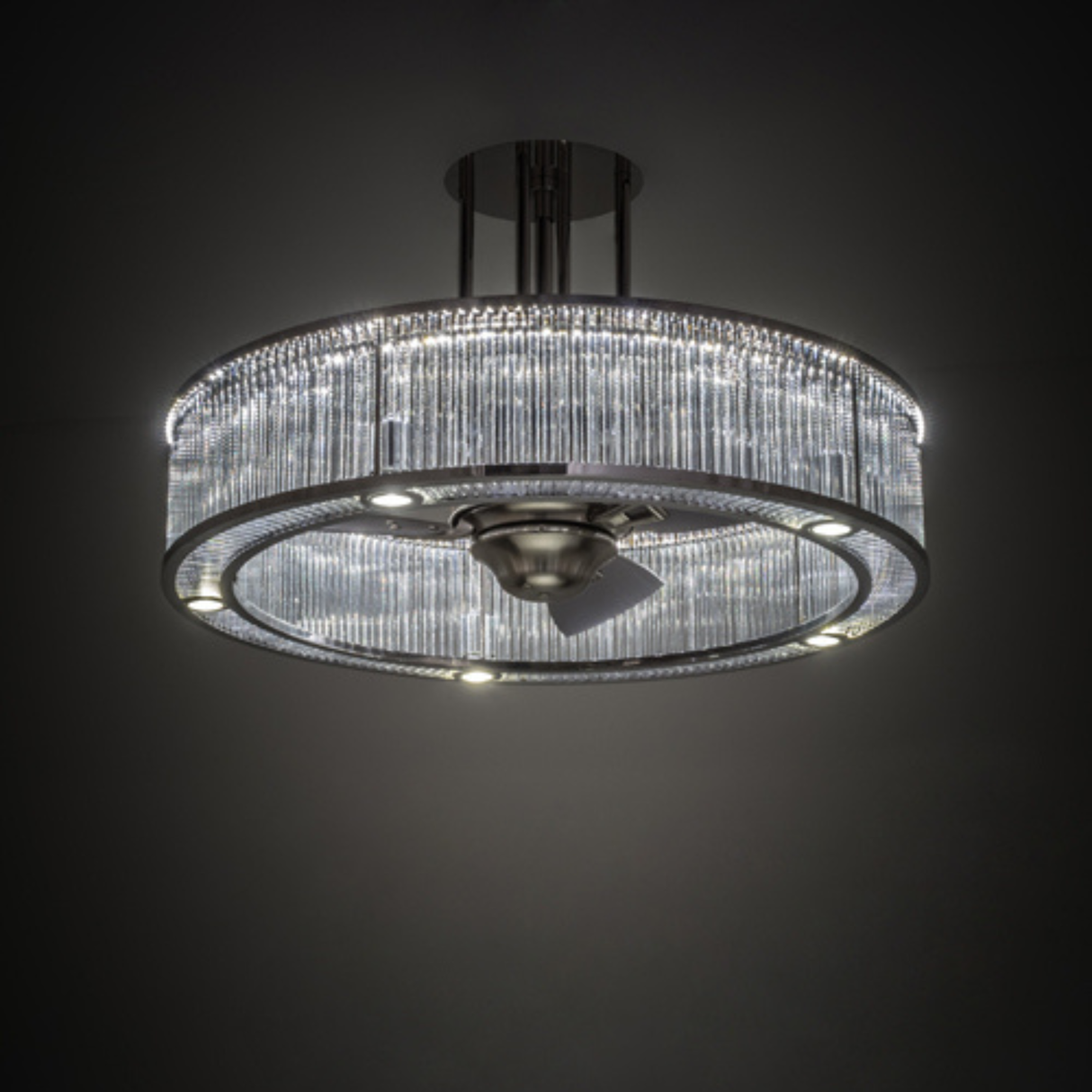 Lit view in dark room highlighting glowing prismatic glass.