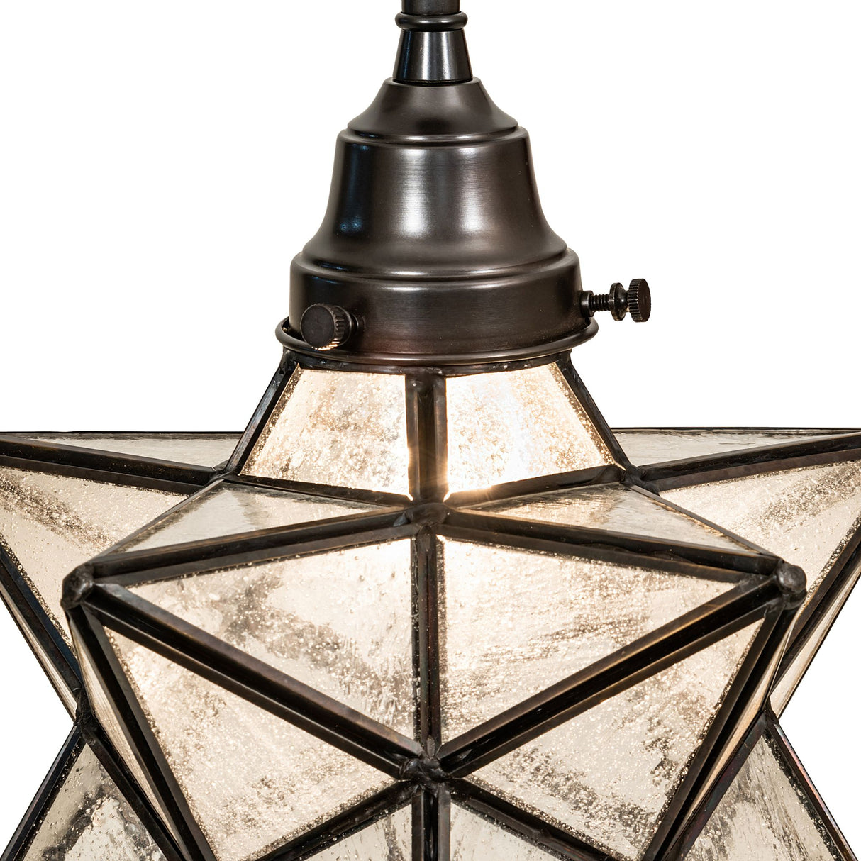 Detailed close-up of the Moravian Star pendant’s handcrafted brass and glass construction.