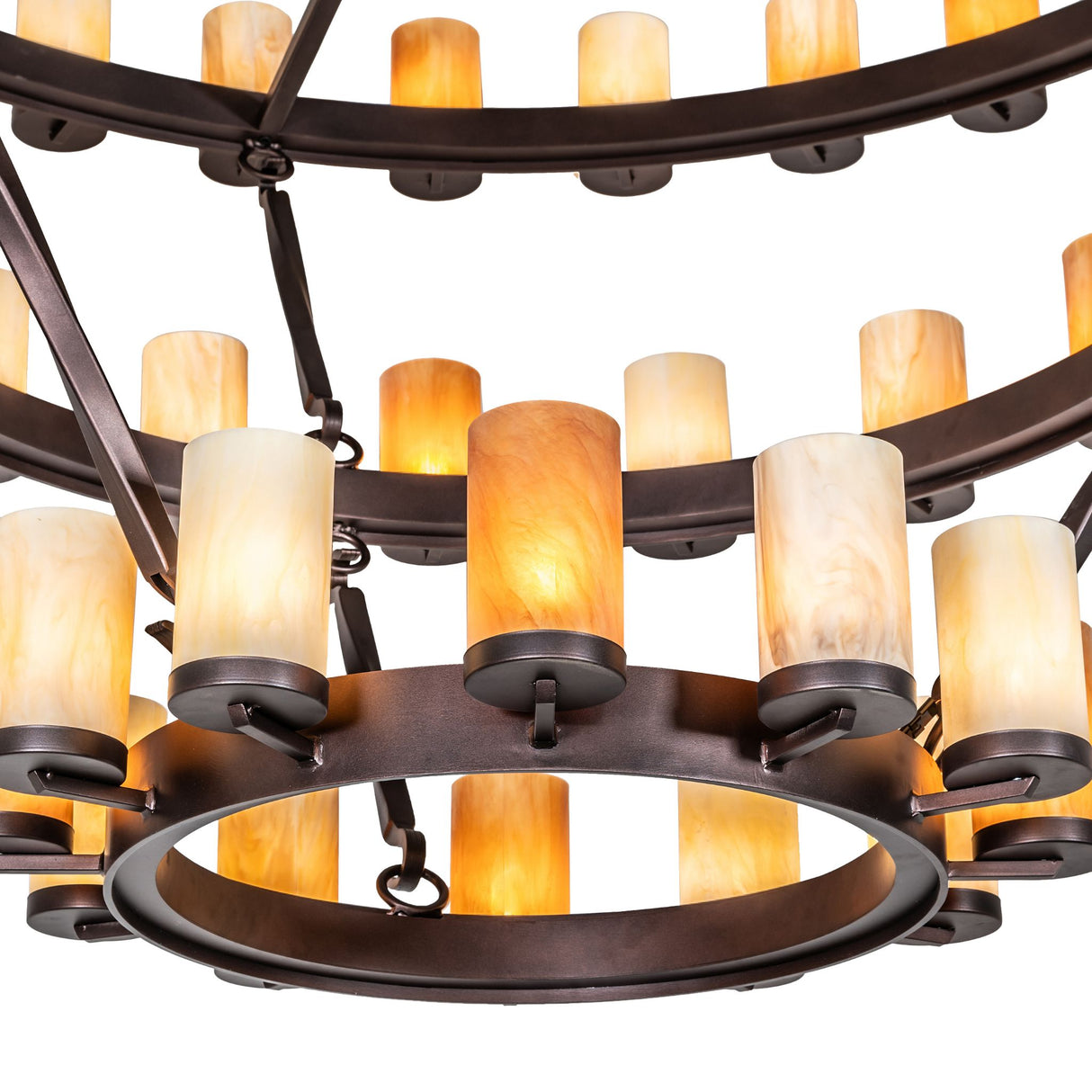 Close-up of cylindrical Idalight glass shades on three-tier chandelier.