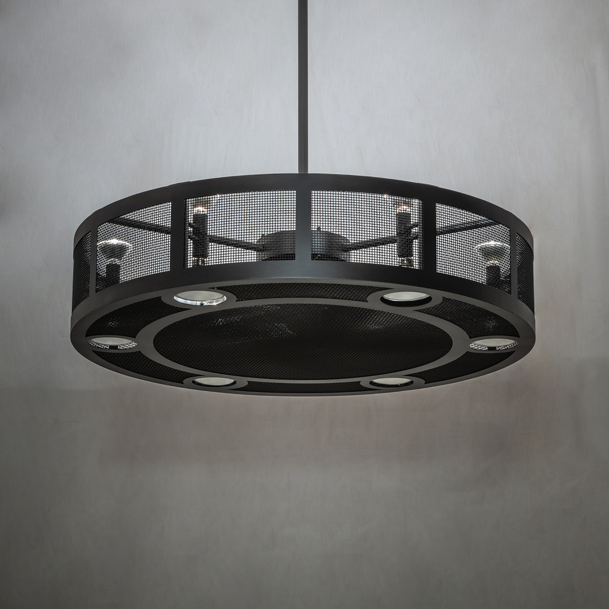 Unlit Paloma Golpe chandelier fan in ambient room setting.