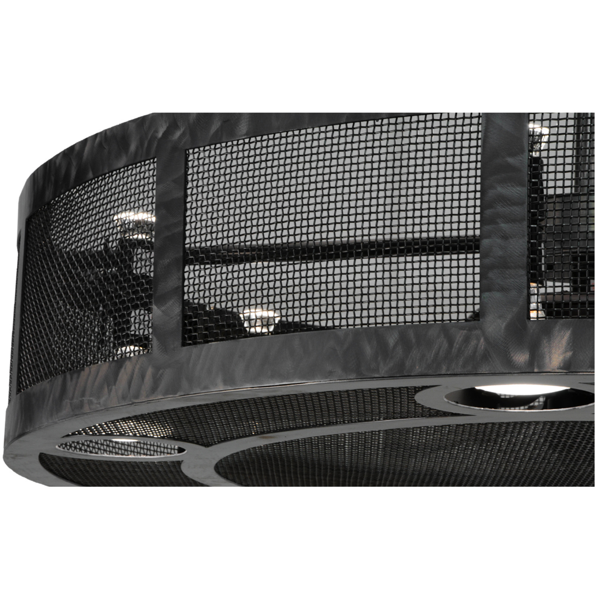 Closeup of black mesh grill and circular metal trim detailing.