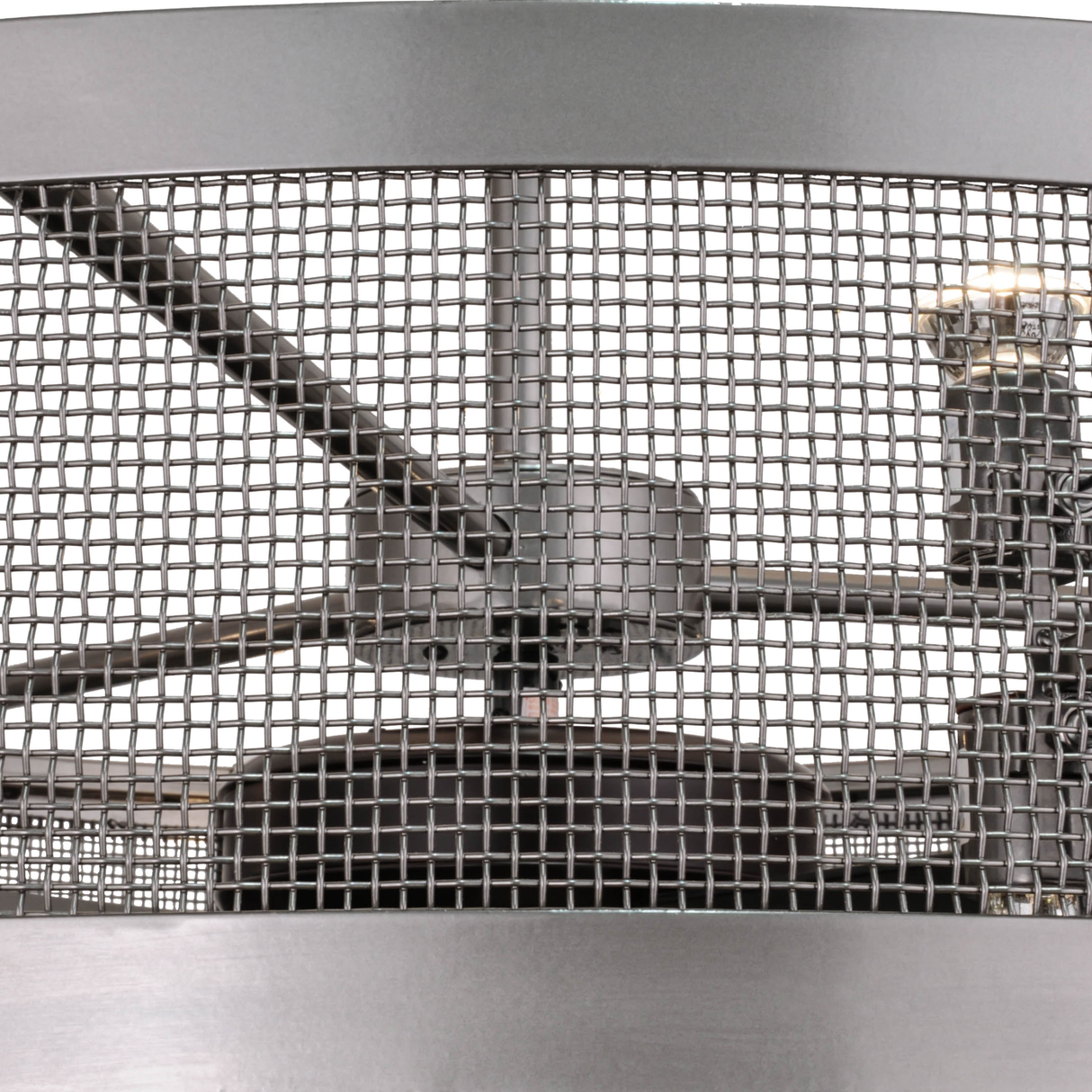 Closeup of illuminated metal mesh showing internal fan assembly.