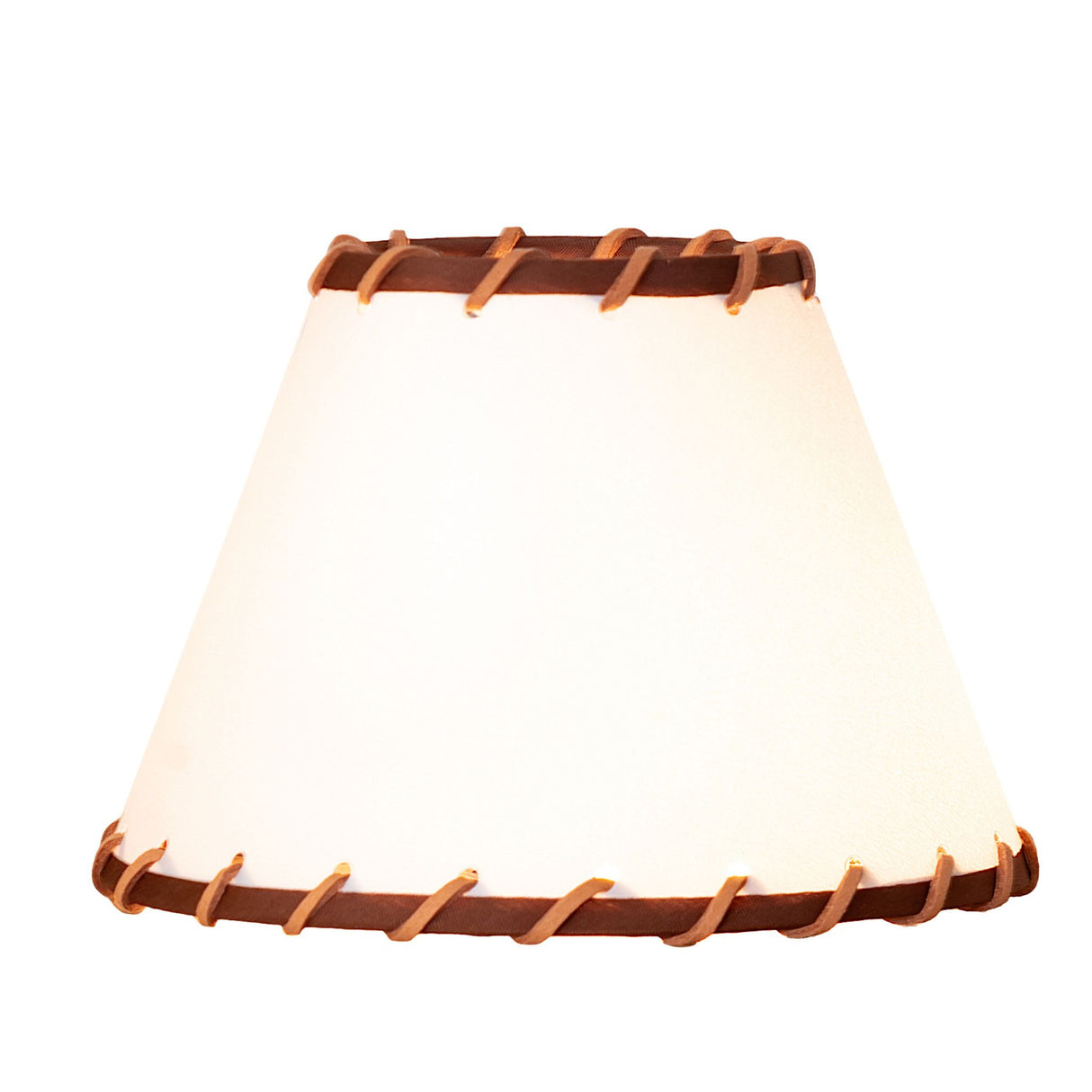 lit view of parchment and rawhide shade casting a warm, rustic glow.