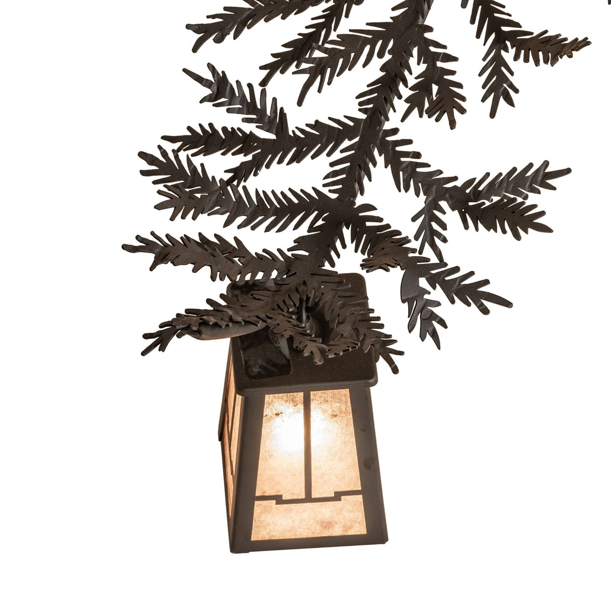 Detailed view of pine needle metal accents and branch-shaped chandelier arm.