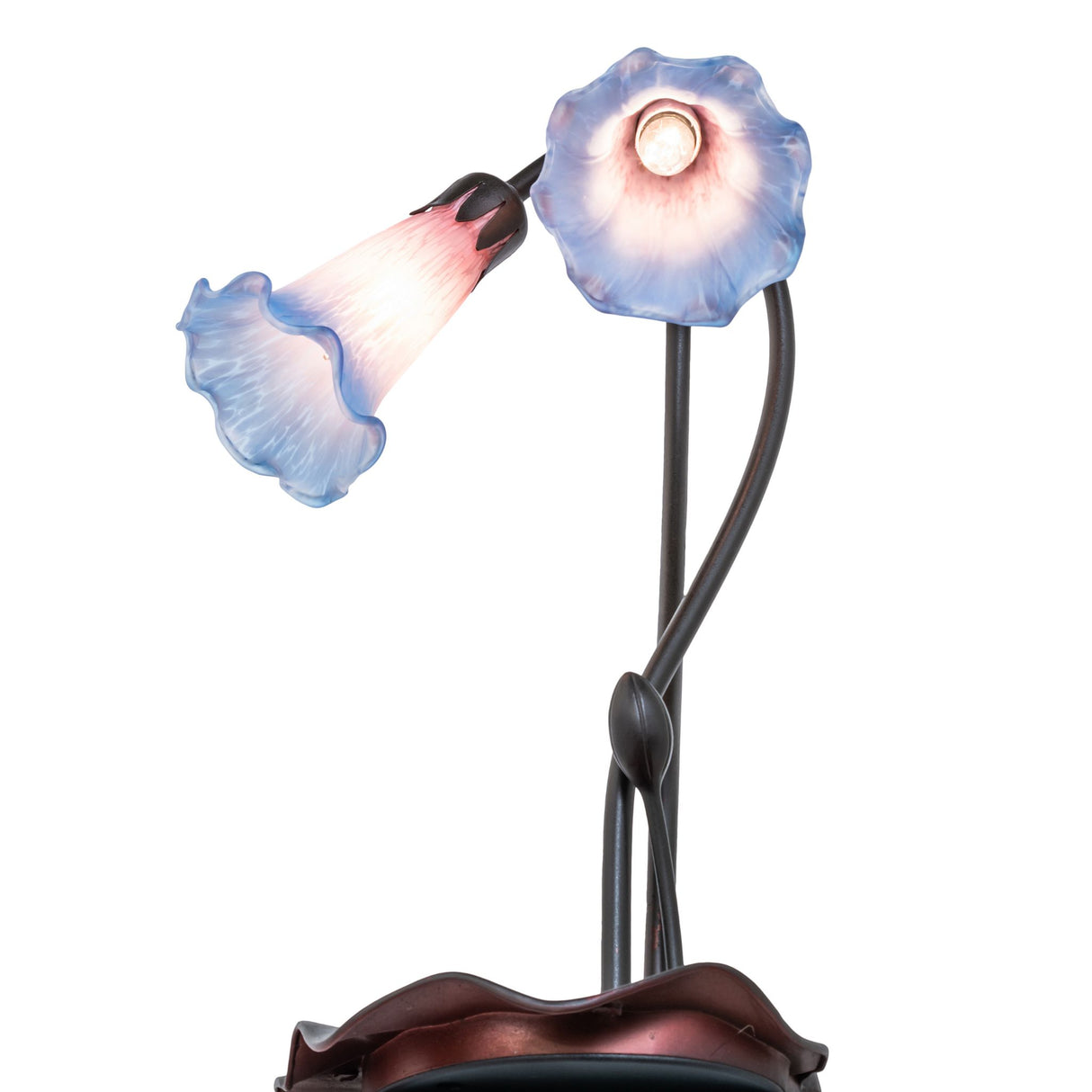 angled view showing intricate lamp base and lily stems.