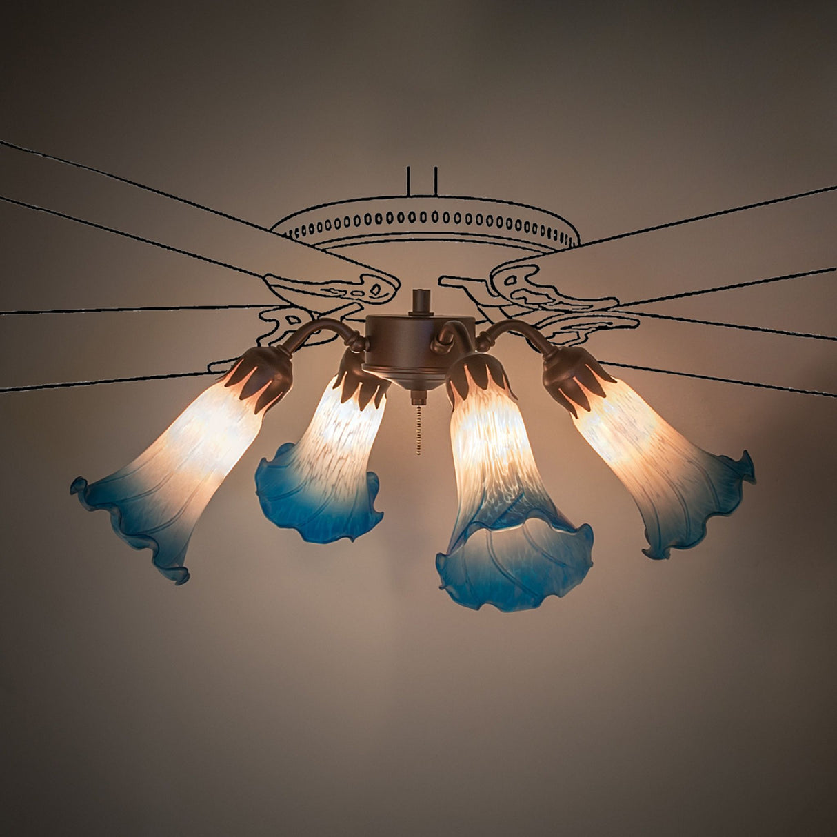 Fan light illuminated with pink and blue Tiffany-style glass.
