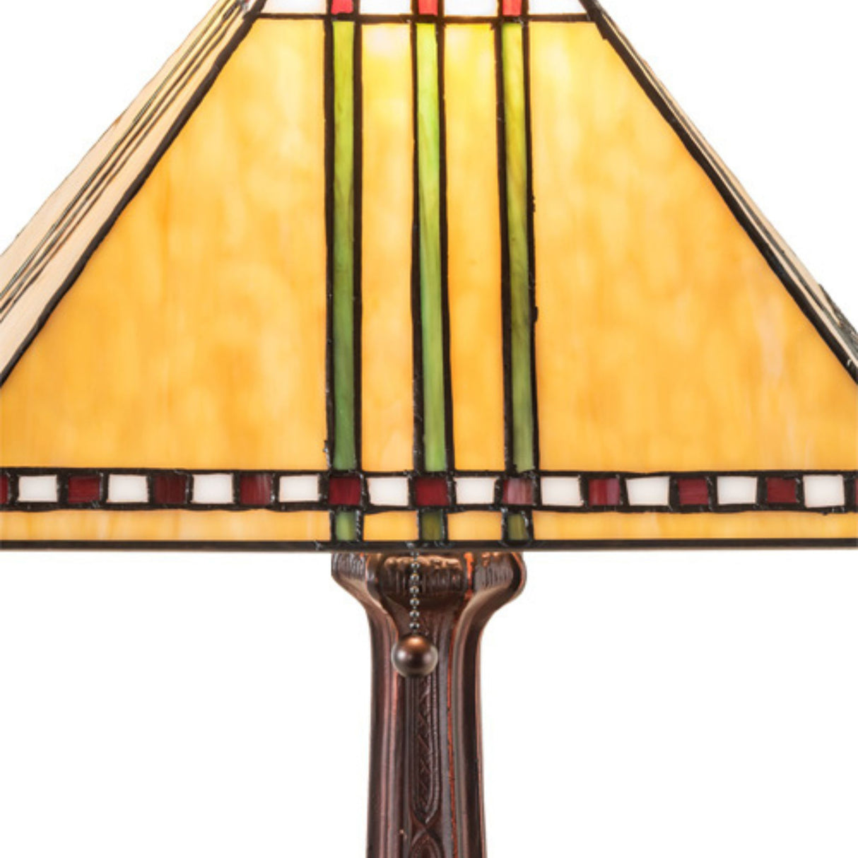 Close-up of Prairie Corn table lamp's stained-glass shade with warm amber tones and linear patterns.
