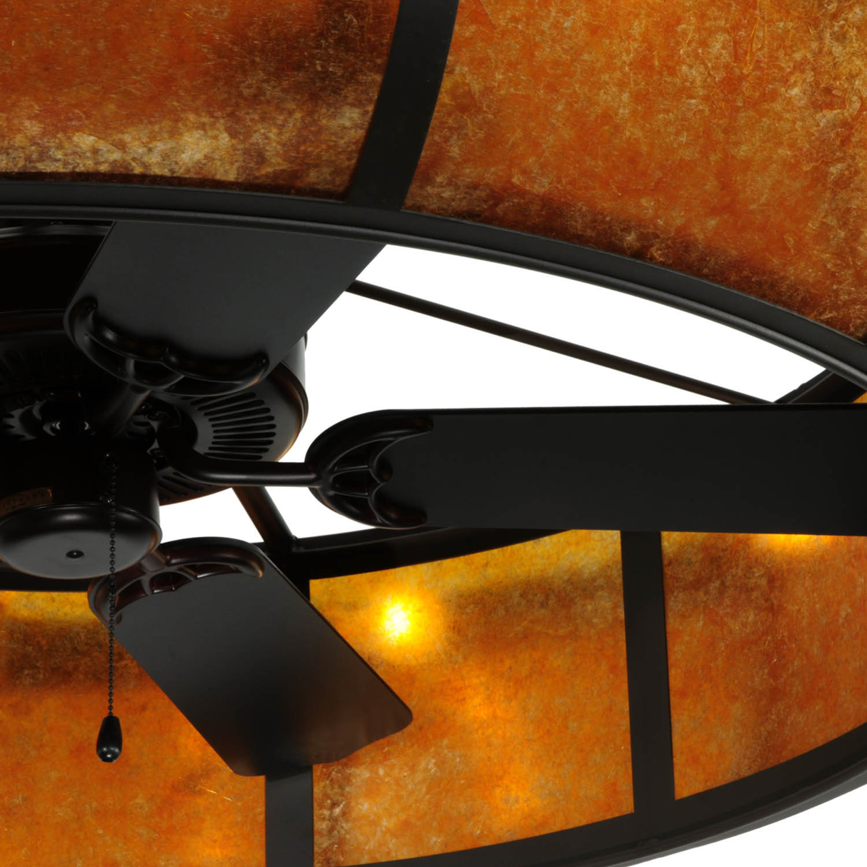 Detail view of fan blade under warm mica lighting.