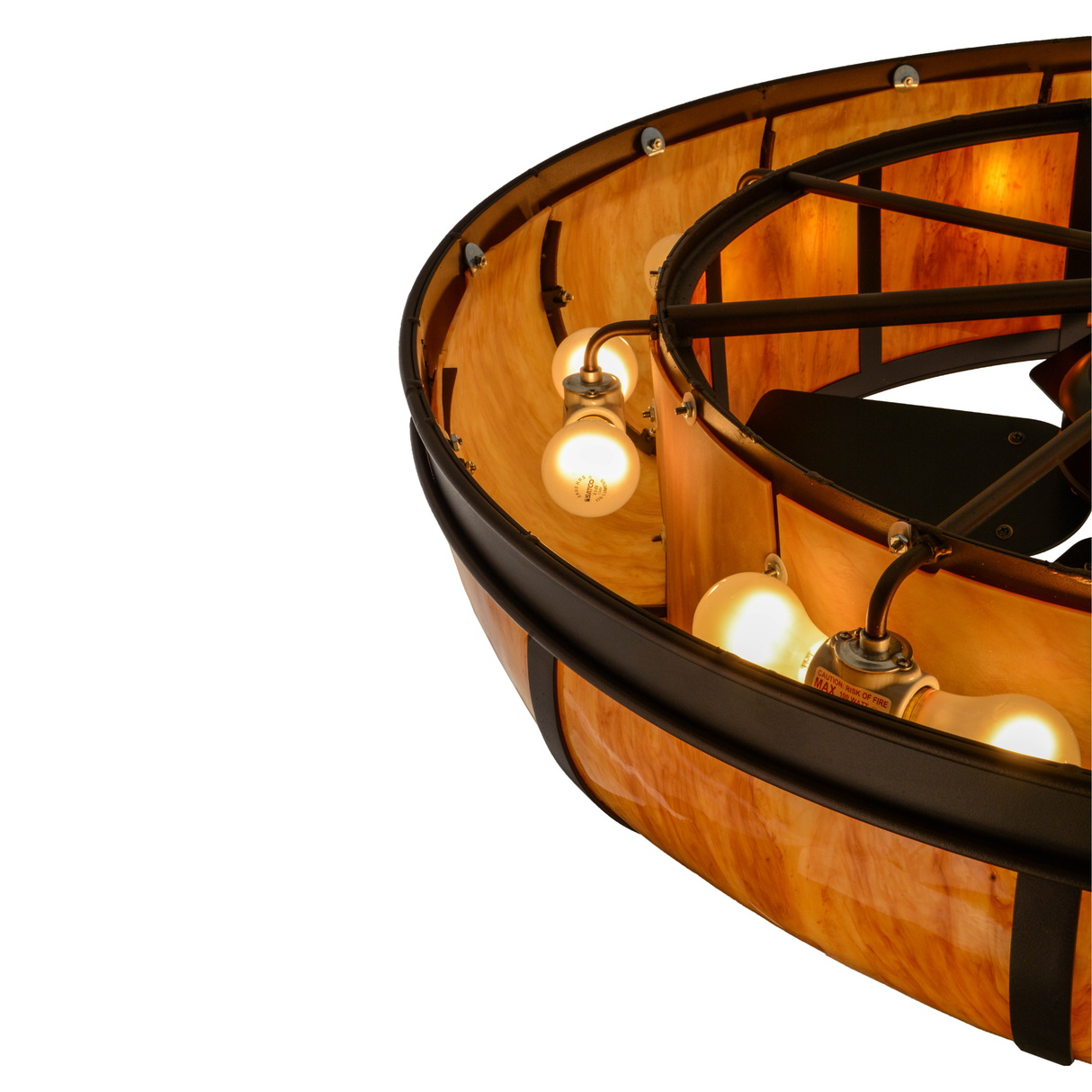 Closeup of interior bulbs and metal supports inside amber diffuser.