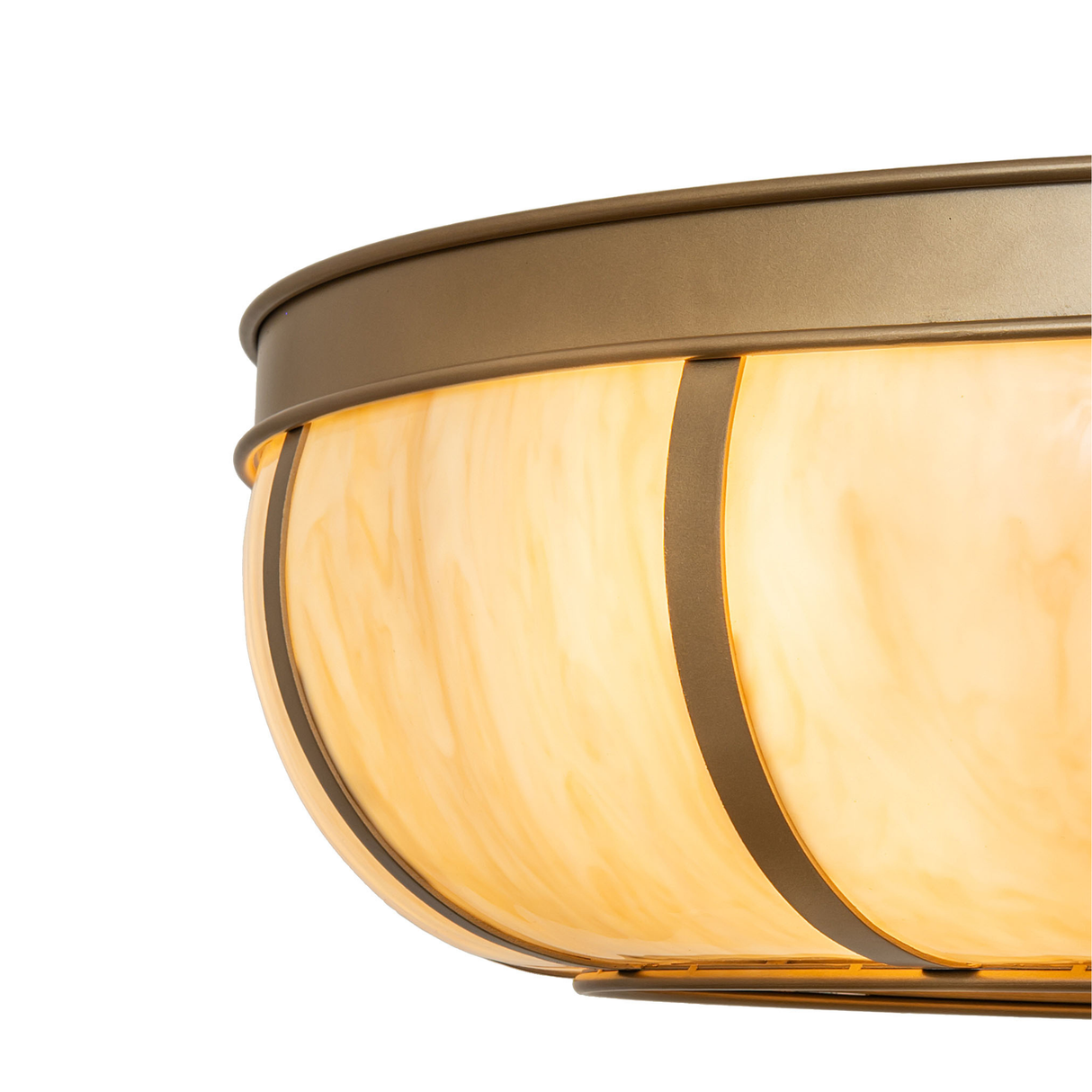Close-up of amber dome lens and gold metallic trim.