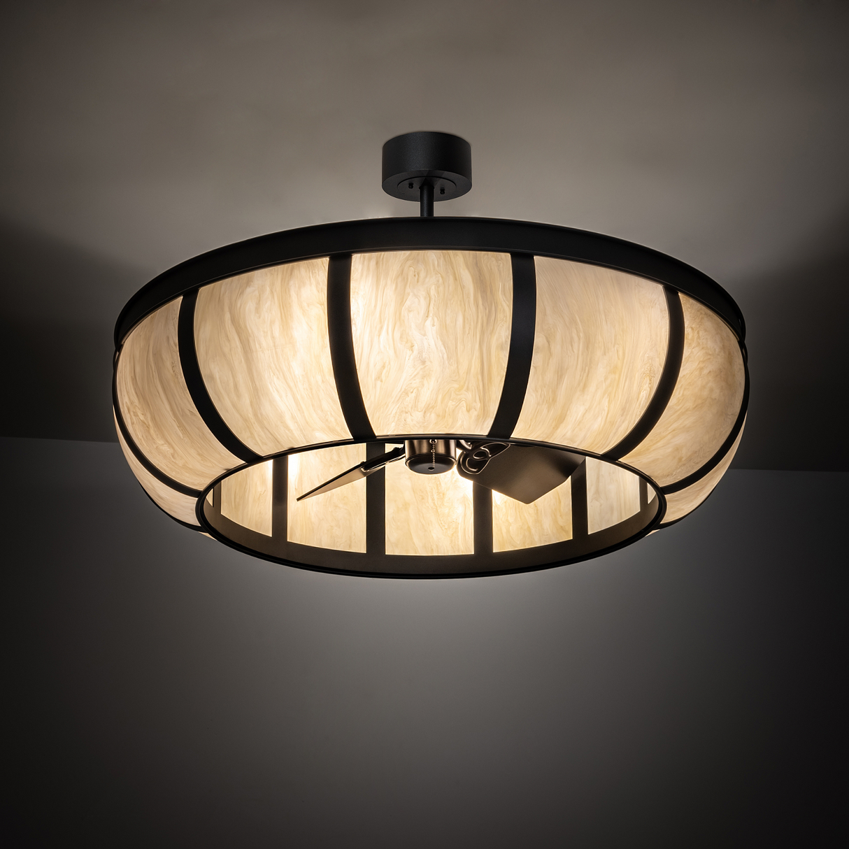 Warmly illuminated Prime Dome Chandel-Air in ambient room lighting.