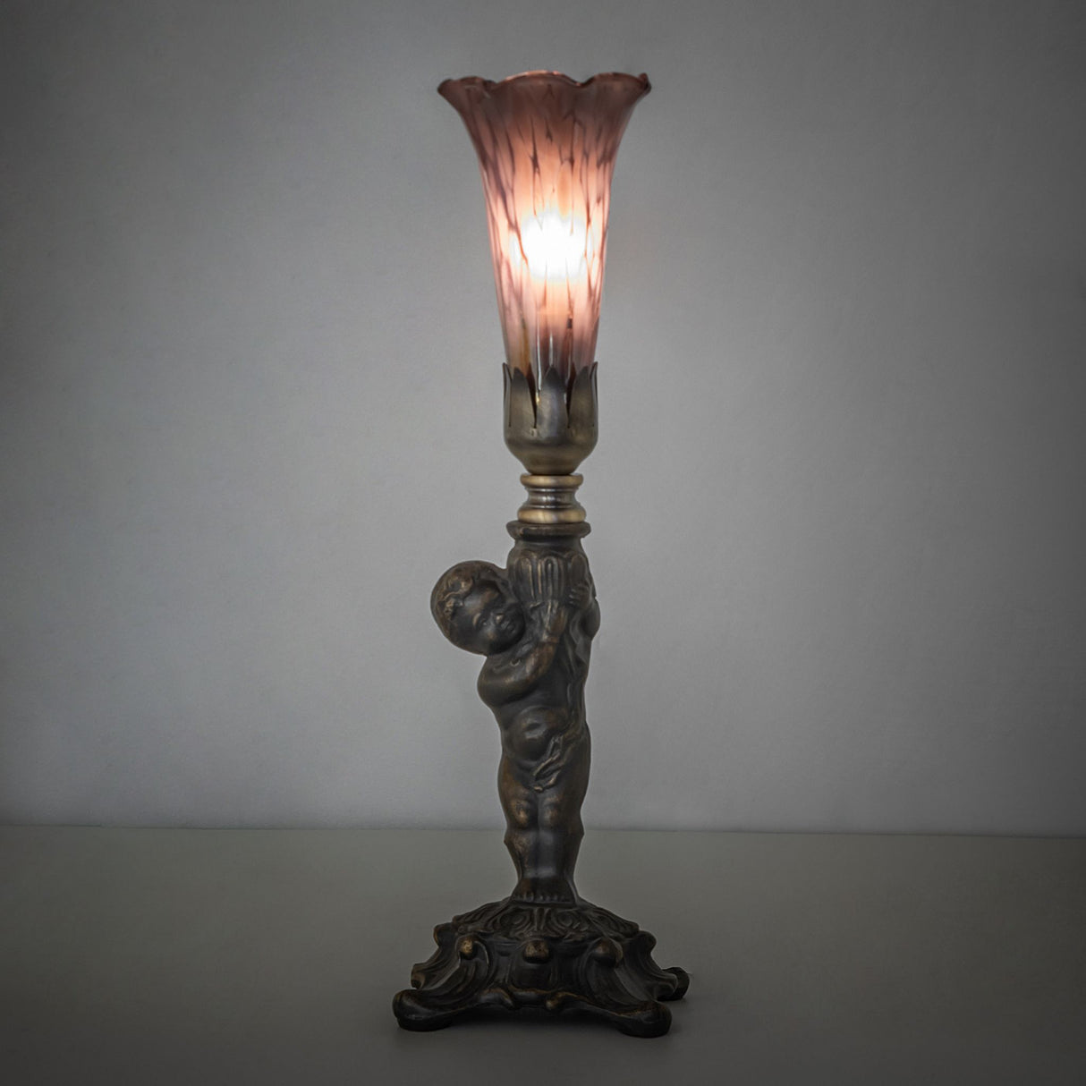 Purple Iridescent Pond Lily Mini Lamp lit in ambient room setting.