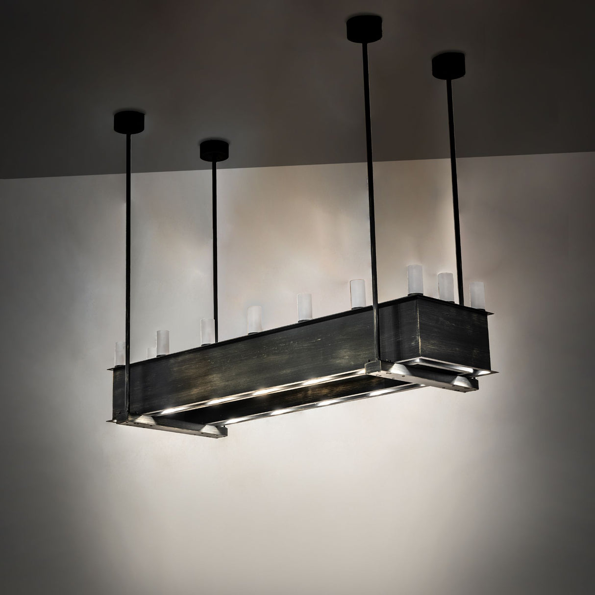 Illuminated from lower recessed LEDs, casting focused downward lighting.