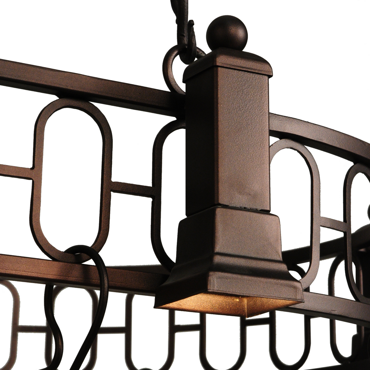 Close-up of lighted column and hooks on pot rack.