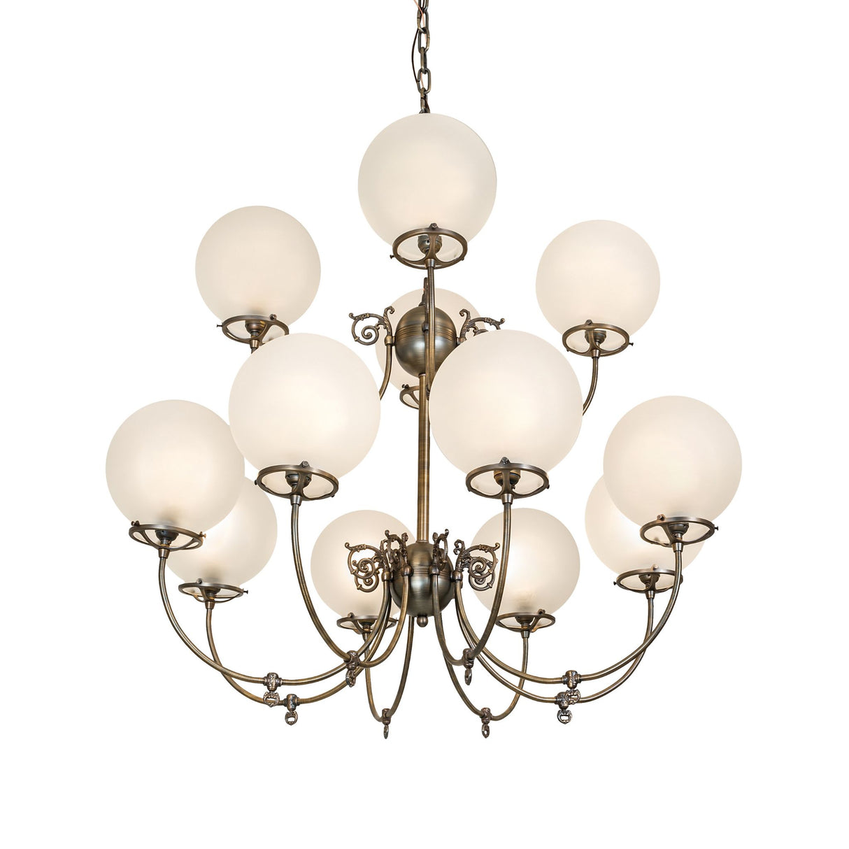 Lit view of gas and electric chandelier with frosted globe shades and antique brass finish.
