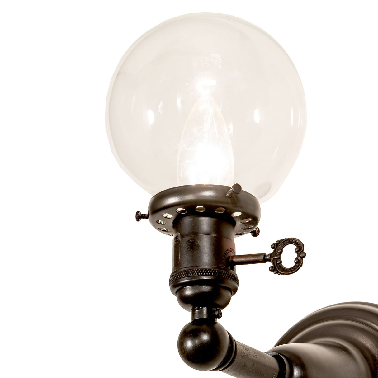 Side close-up showing the clear glass globe and brass hardware.
